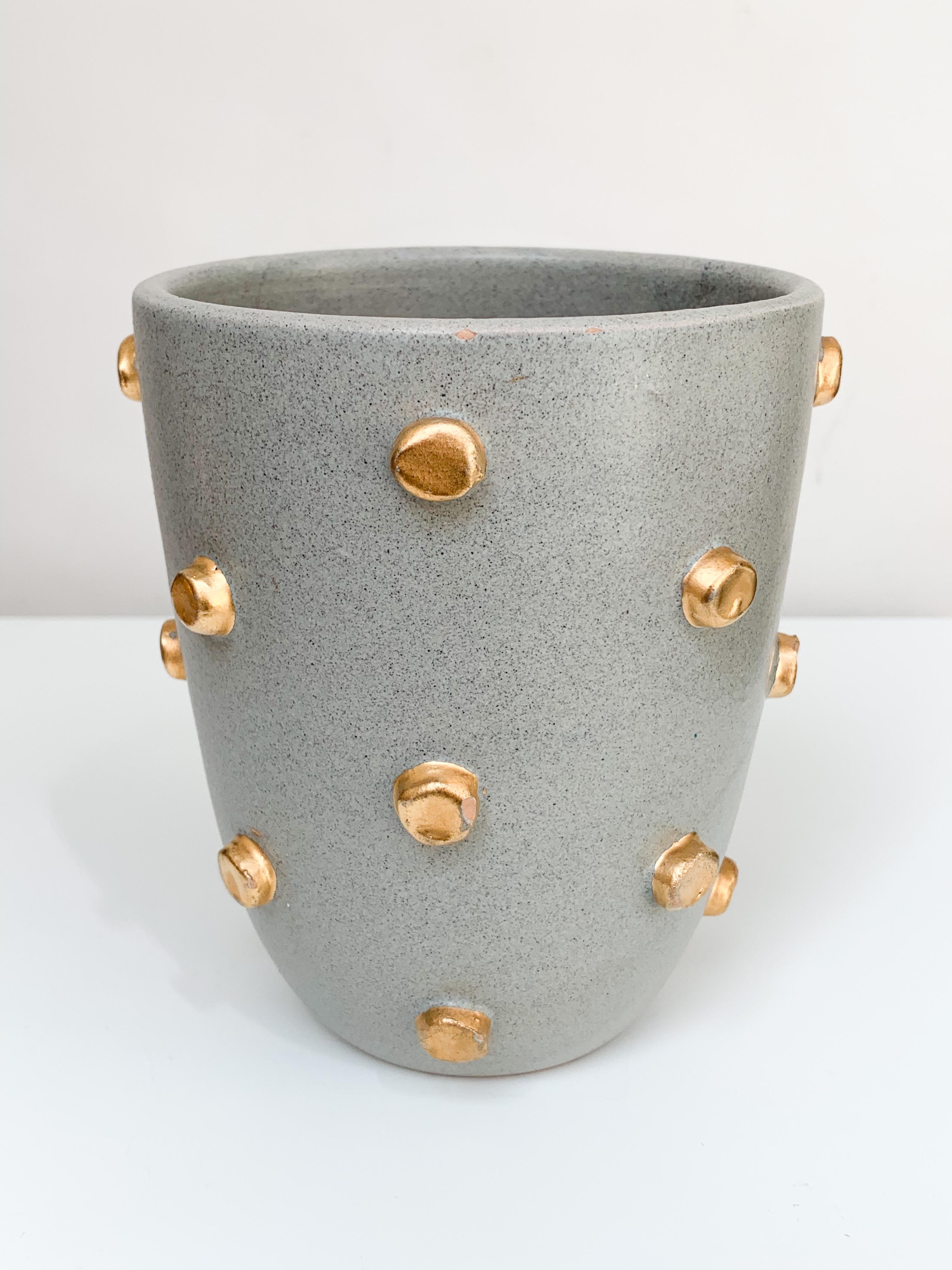 Bitossi vase, ceramic, gray and gold hobnails, signed. Small scale chunky vase with gray glaze and decorated with applied gold hobnails. Vase is marked 95/393 Italy. Measures: 4.75