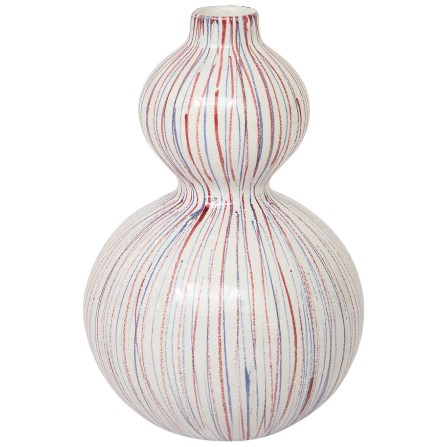 Bitossi vase, ceramic, pinstripes, white, red, and blue, signed. Small scale double gourd form vase decorated with red and blue pinstripes over white. Signed on the underside: LV 256/24 Italy.