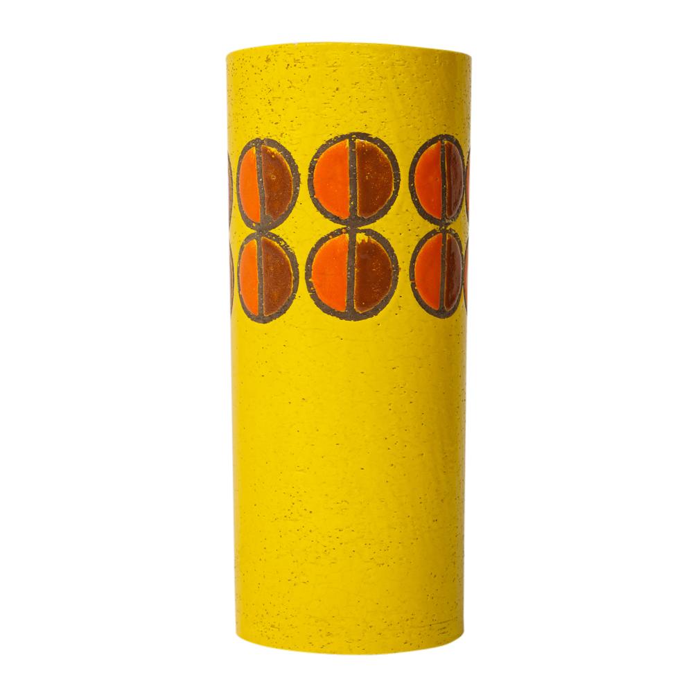 Bitossi for Rosenthal netter vase, ceramic, yellow, orange, discs, signed. Tall yellow glazed cylinder vase decorated with two rows of half circles, in dark and lighter shades of orange. Retains original faded paper import label on the underside.