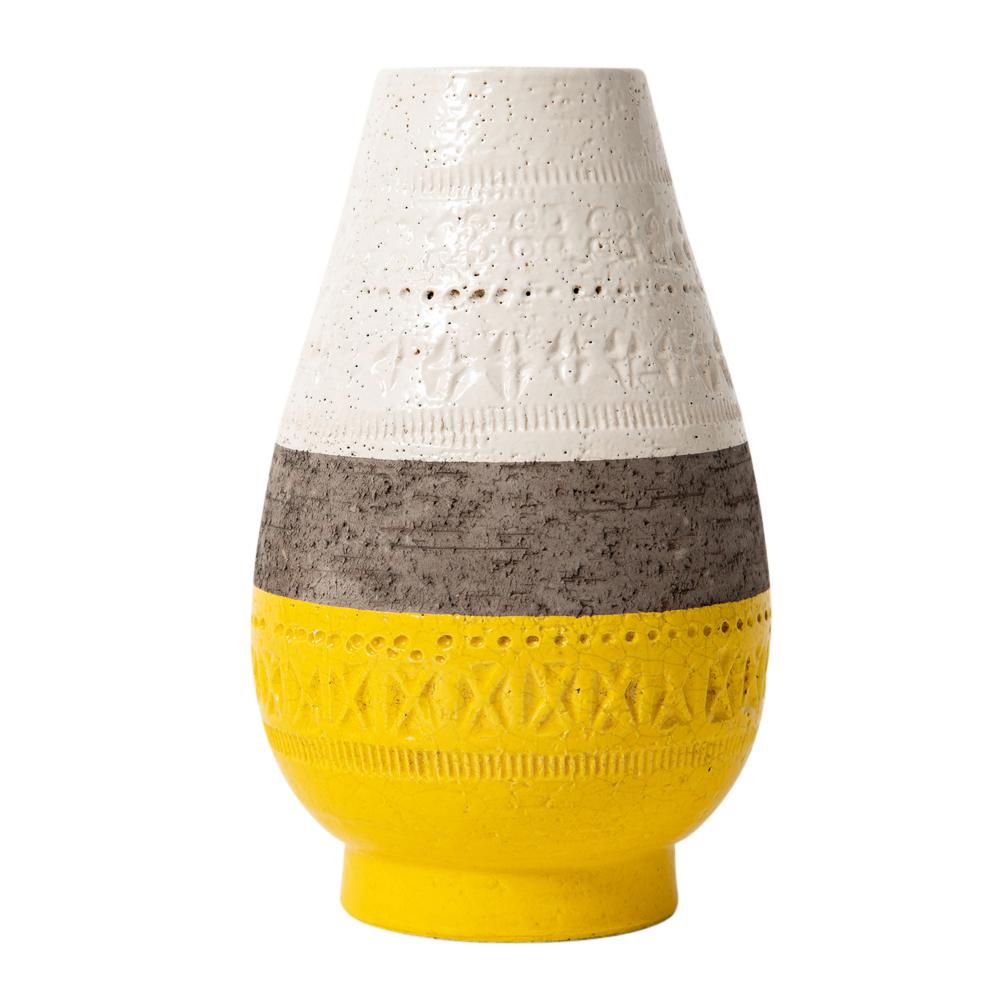 Bitossi vase, ceramic, yellow, white, brown, geometric. Small scale teardrop form vase with footed base, having glazed bands of white, matte brown, and yellow which are decorated with hand tooled impressed geometric patterns. Remnants of an old