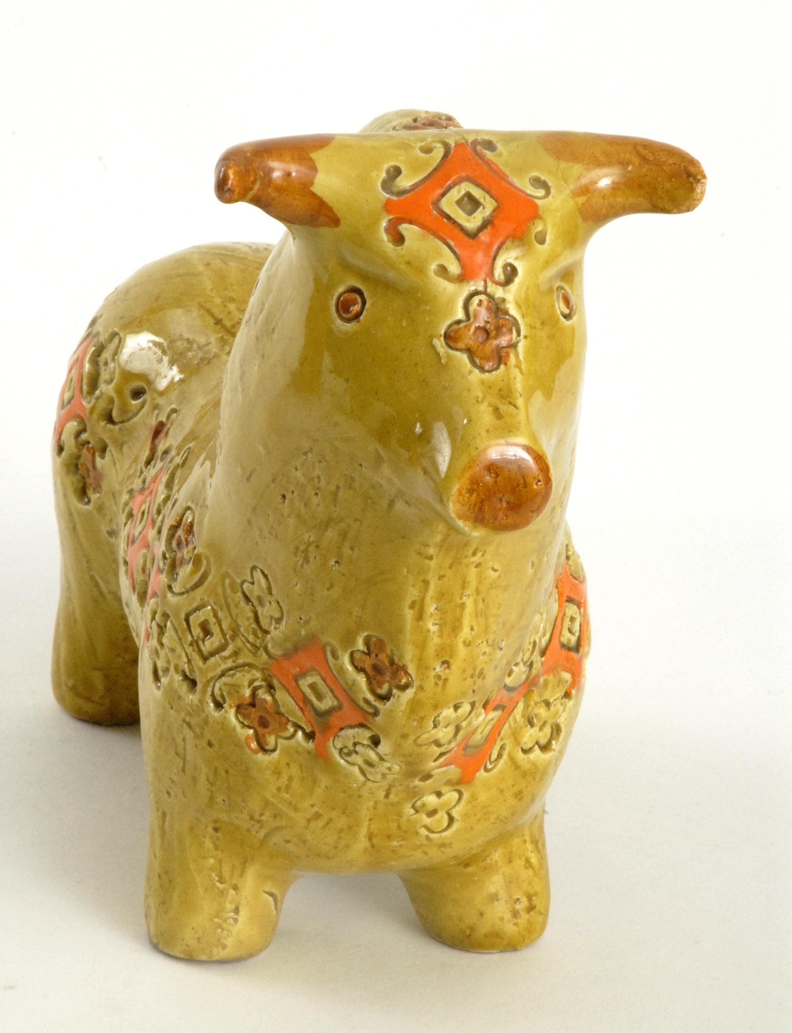 A large yellow ochre 'Spagnoli' pattern [Spanish] bull with orange highlights in the stamped pattern. Marked in black on the underside.