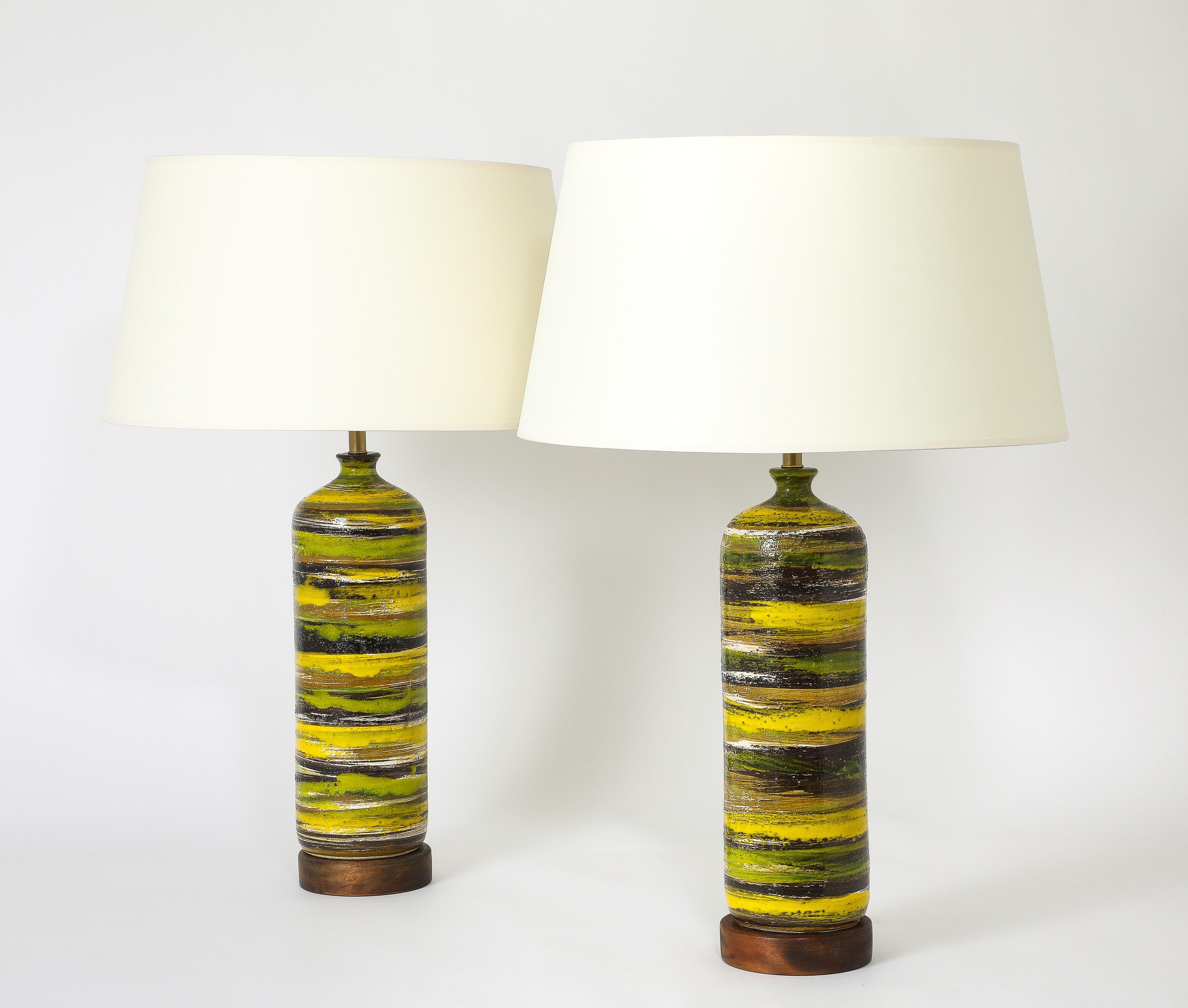 Beautiful pair of striped lamps with a yellow dominant on walnut bases.