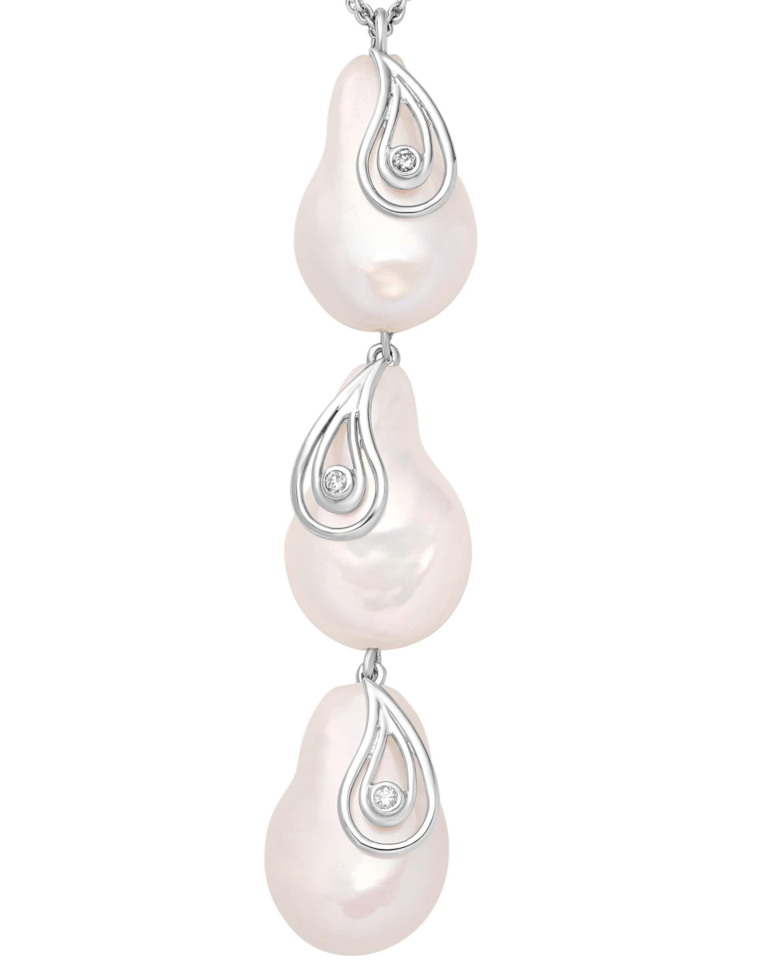 Reflecting the still waters of Lake Biwa, this 18K white gold necklace from Yvel’s Biwa Collection elegantly aligns round Freshwater coin pearls in a descending harmony. Each pearl is embraced by a delicate silver teardrop silhouette, featuring a