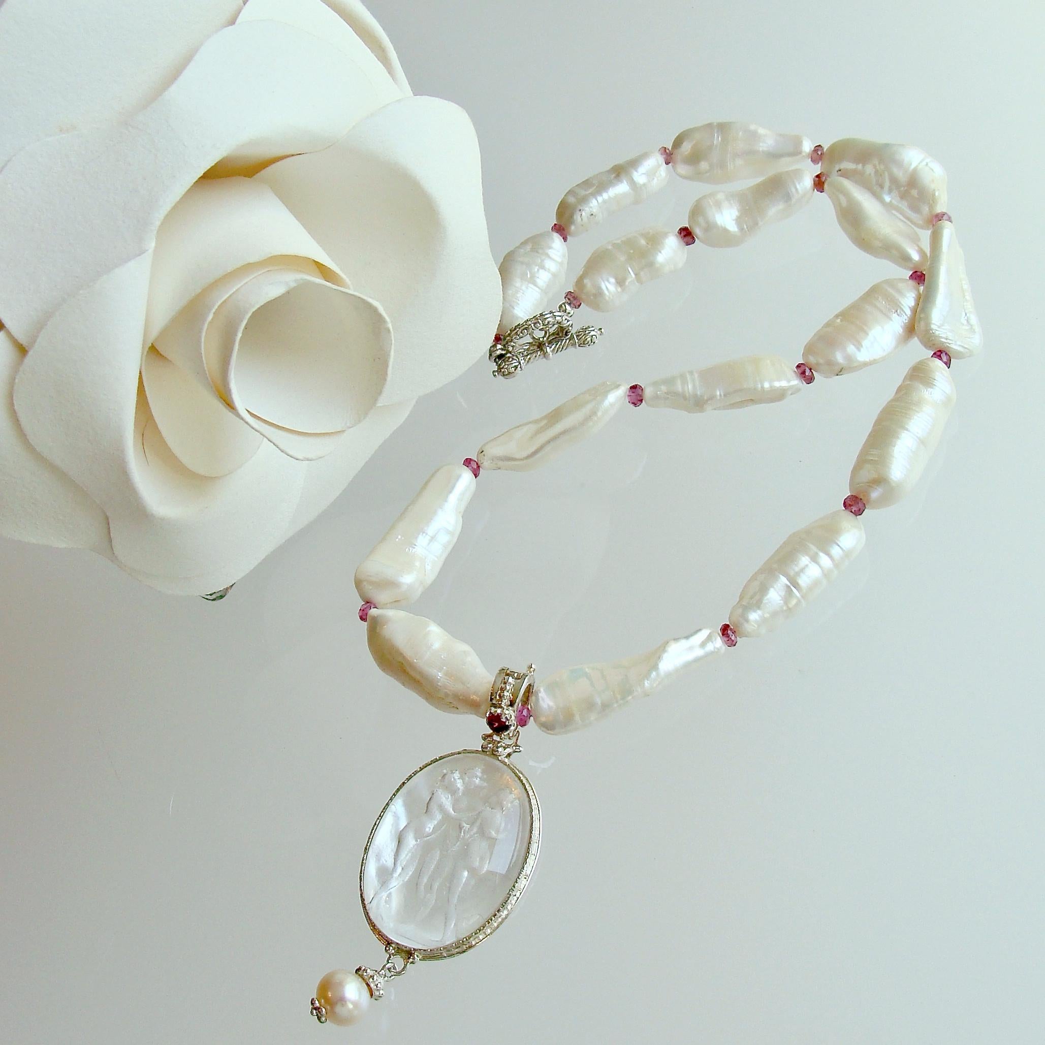 A trail of creamy elongated Biwa Pearls have been separated with small rondelles of pink tourmaline to create this lovely and wedding—worthy necklace.  The culmination of this design is a white Venetian intaglio (backed with Mother of Pearl) pendant
