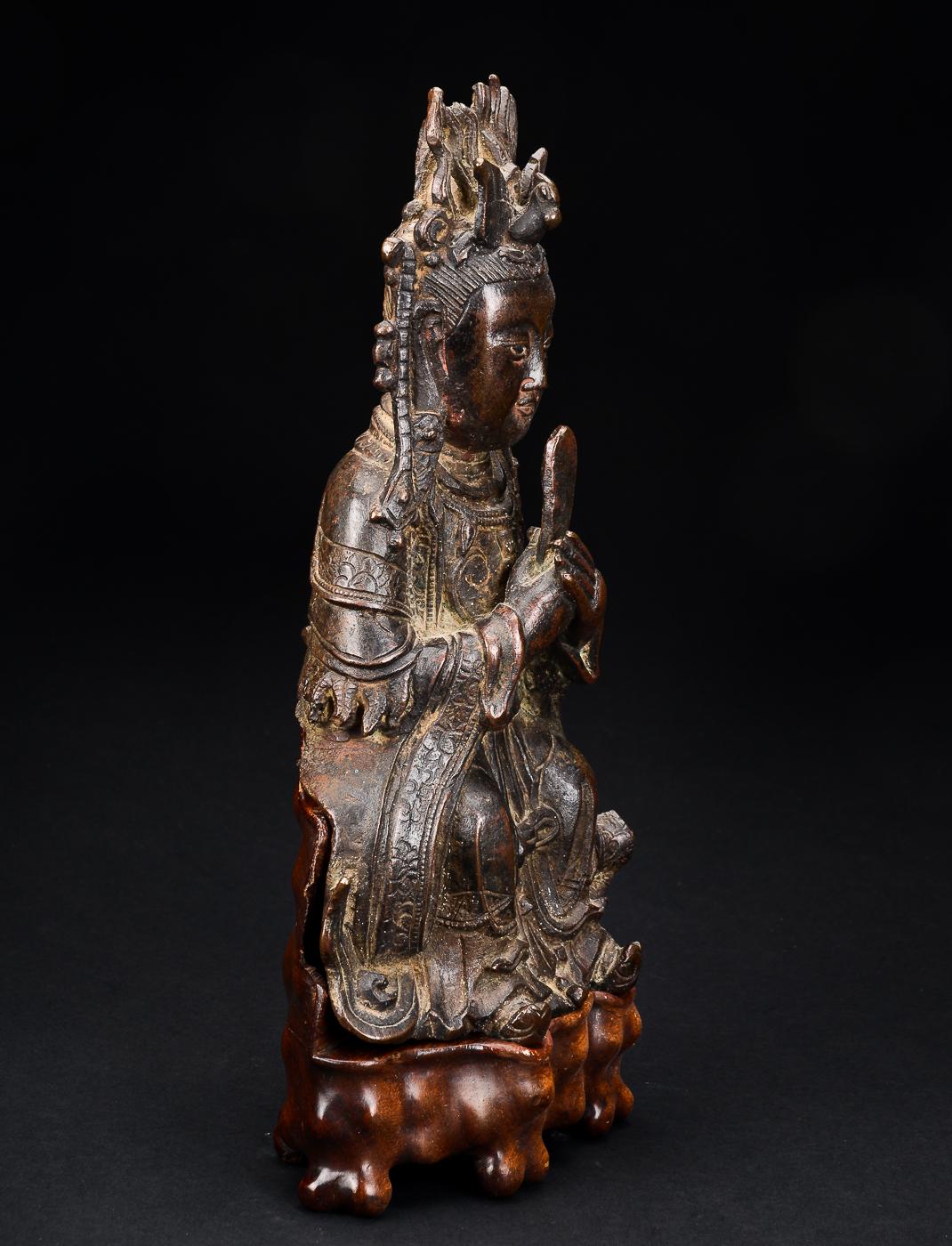 Bixia Yuanjun figure of bronze dated Ming Dynasty 1368-1644. 
Base of hardwood.
Height excluding base 26cm;
Heigh including base 31cm. 

Condition:
Corrosion on reverse/back;
Crown missing pieces;
Gilt worn off. 


Provenance: 
Brunn