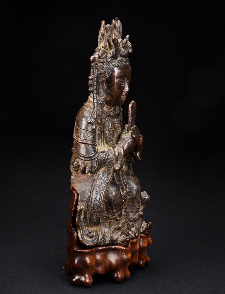 Bixia Yuanjun figure of bronze dated Ming Dynasty 1368-1644. 
Base of hardwood.
Height excluding base 26cm;
Heigh including base 31cm. 

Condition:
Corrosion on reverse/back;
Crown missing pieces;
Gilt worn off. 


Provenance: 
Brunn