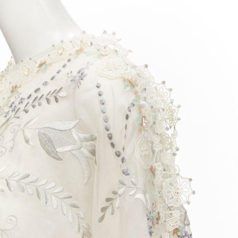BIYAN beige 3D intricate lace bead crystal embellished cape top  XS
Reference: AAWC/A00284
Brand: Biyan
Material: Cotton, Blend
Color: Beige
Pattern: Embellishments
Closure: Keyhole Button
Made in: Indonesia

CONDITION:
Condition: Excellent, this