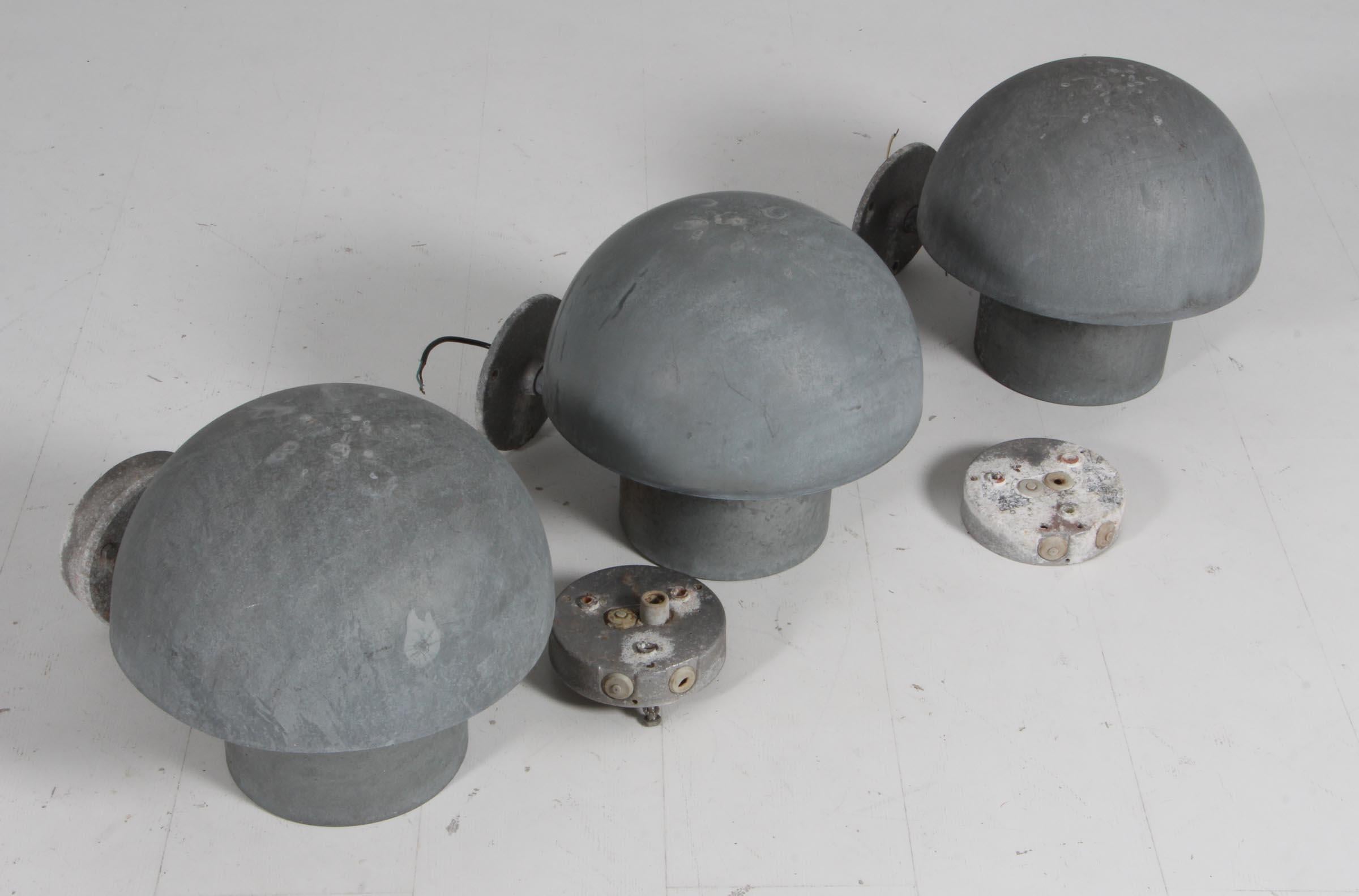 Outdoor wall lamps made of galvanized steel, designed in the 1930s by Bjarne Bech and produced by Louis Poulsen.

