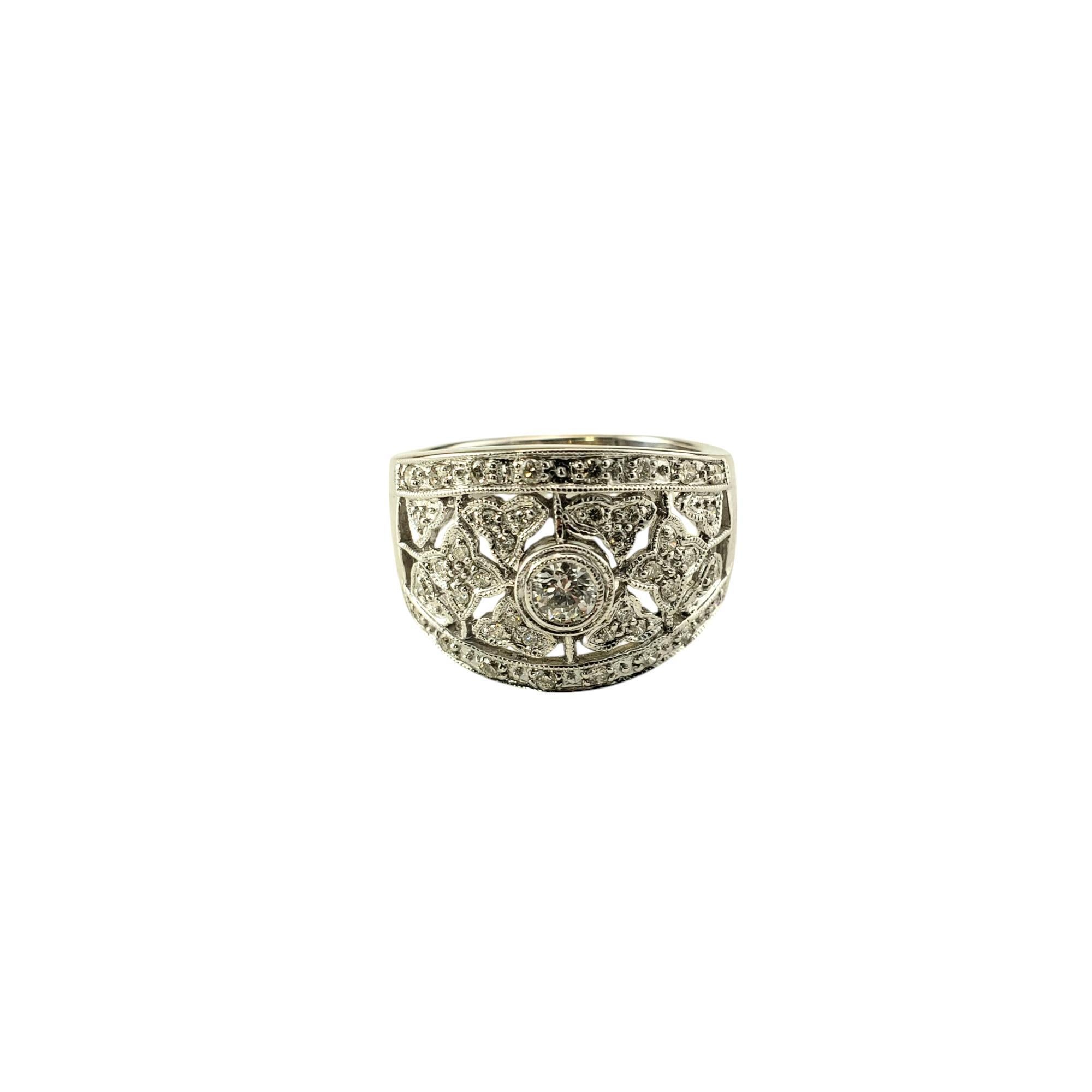 14 Karat White Gold and Diamond Band Ring Size 7.25

This sparkling band features 41 round brilliant cut diamonds set in beautifully detailed 14K white gold.
Width: 15 mm. Shank: 4 mm.

Approximate total diamond weight: .40 ct.

Diamond color: