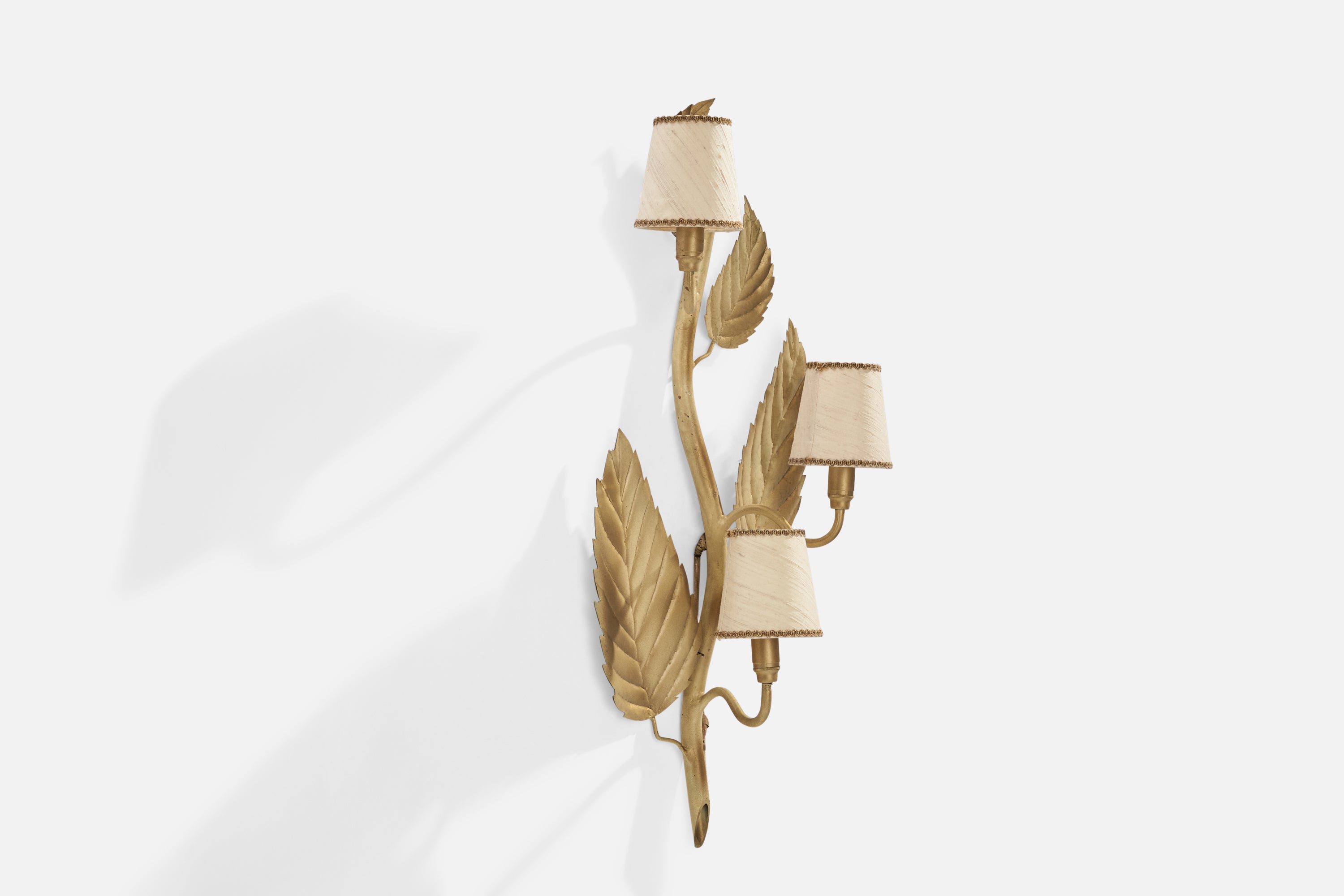 A three-armed beige-lacquered metal and off white fabric wall light attributed to Bjerkås Armatur, Sweden, c. 1940s.

Overall Dimensions (inches): 30”  H x 12”  W x 7.25”  D
Back Plate Dimensions (inches): N/A
Bulb Specifications: E-14 Bulb
Number