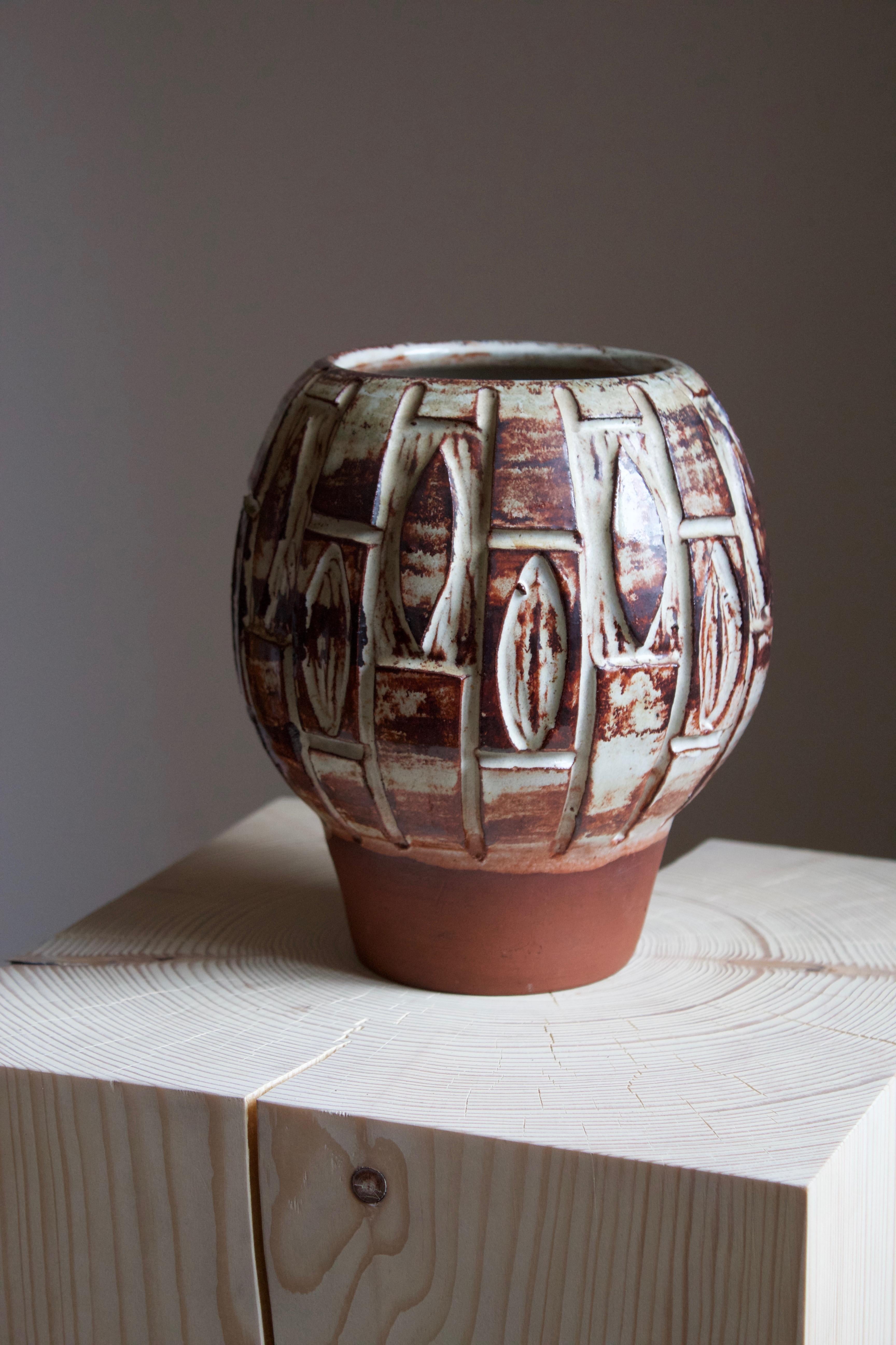 A vase by Björn Backhausen for Pottemagehuset Bornholm, Denmark, 1960s.

Other designers of the period include Ettore Sottsass, Carl Harry Stålhane, Lisa Larsson, Axel Salto, and Arne Bang.