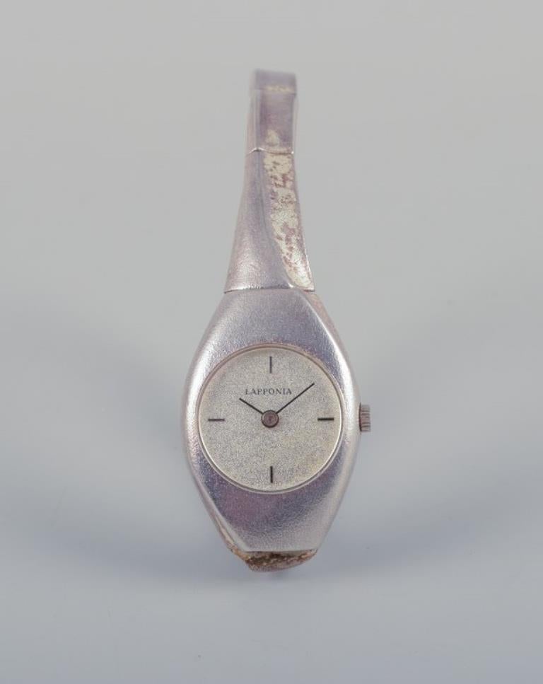 PRE-OWNED GOODS ARE EXEMPT FROM IMPORT TARIFFS FOR U.S., UK, AUSTRALIAN & CANADIAN CUSTOMERS.   
THEREFORE, NO IMPORT TARIFFS WILL BE APPLICABLE TO YOUR PURCHASE. 

Björn Weckström for Lapponia, Finland. 
Ladies' wristwatch in sterling