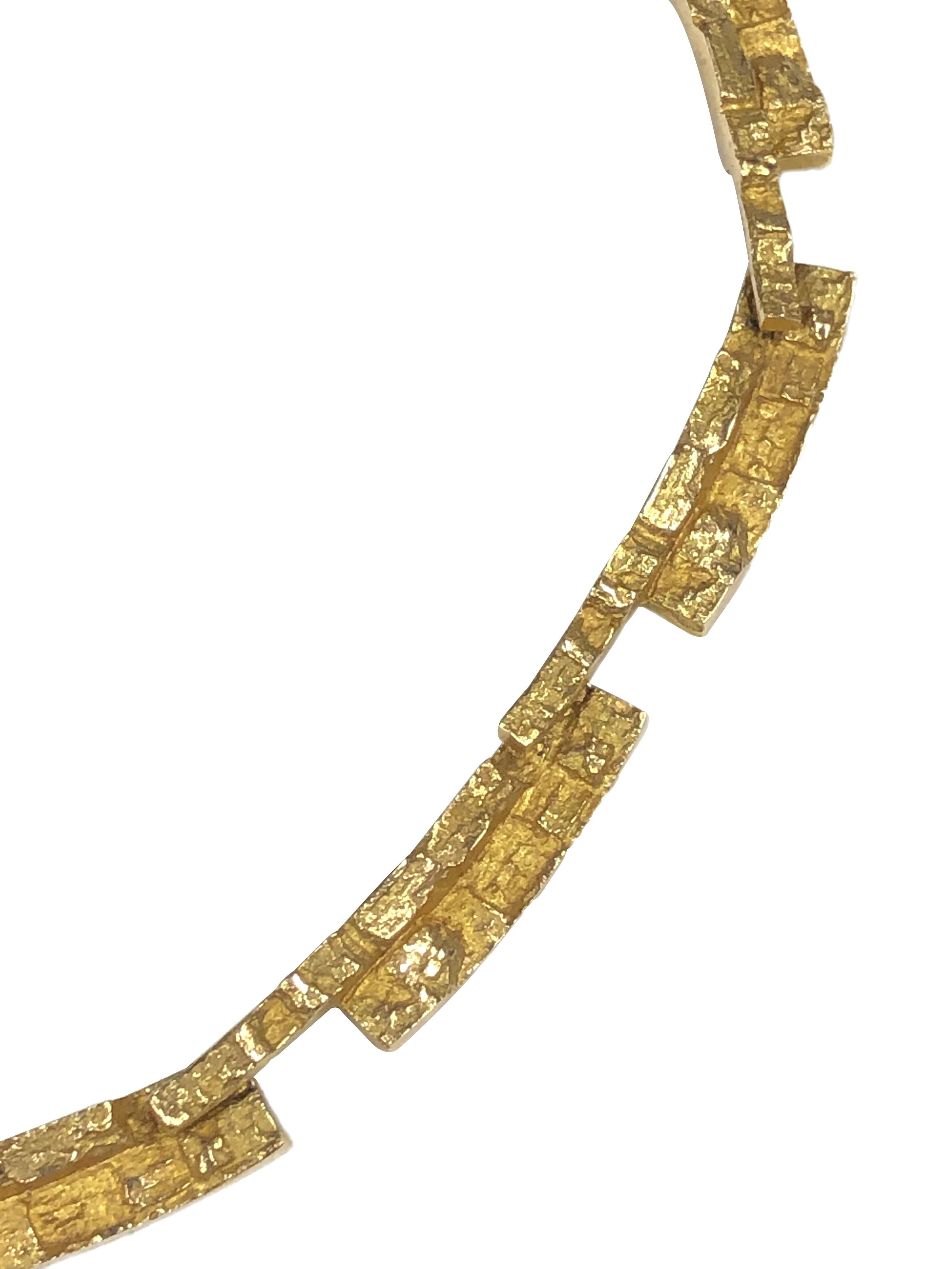 Circa 1968 Bjorn Weckstrom for Lapponia Finland 14k Yellow Gold necklace in a Mid Century Modern design. measuring 16 1/2 inches in length, 3/8 inch wide and weighing 45.3 Grams. Flexible, integrated Textured links.  