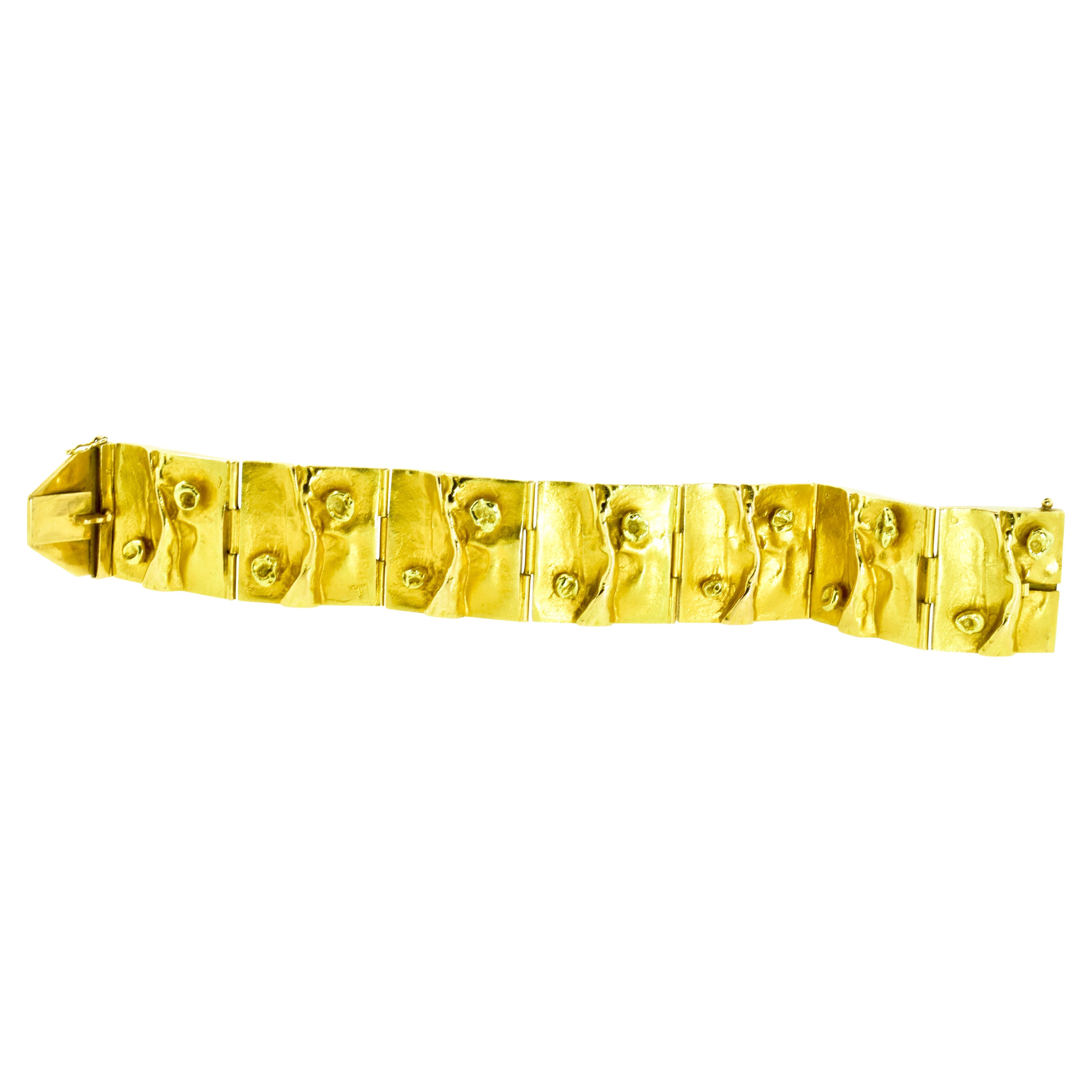 Bjorn Weckstrom 18K yellow gold modernist bracelet.  This handmade bracelet by one of Finland's grand master jewelers. This bracelet is one of his most famous designs.  A very similar necklace and bracelet was worn by Carrie Fisher in the movie Star