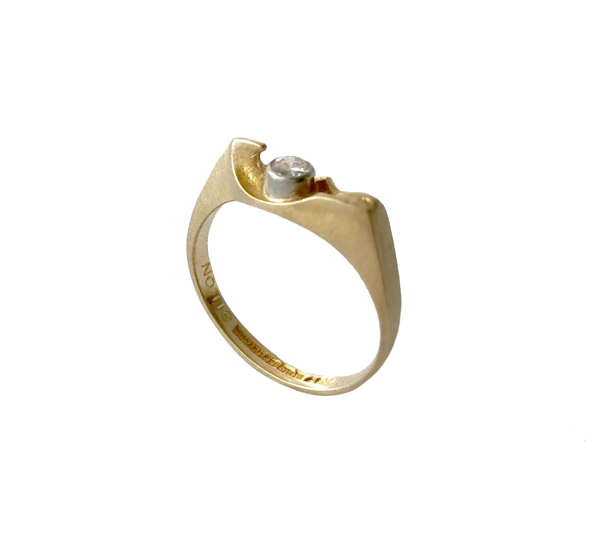 1980's Bjorn Weckstrom for Lapponia Finnish modernist ring of 18K satin gold with solitaire diamond set in platinum bezel. Ring is a finger size 6 and signed F8 (1983), Lapponia, 750.  A modern alternative to a traditional engagement or wedding