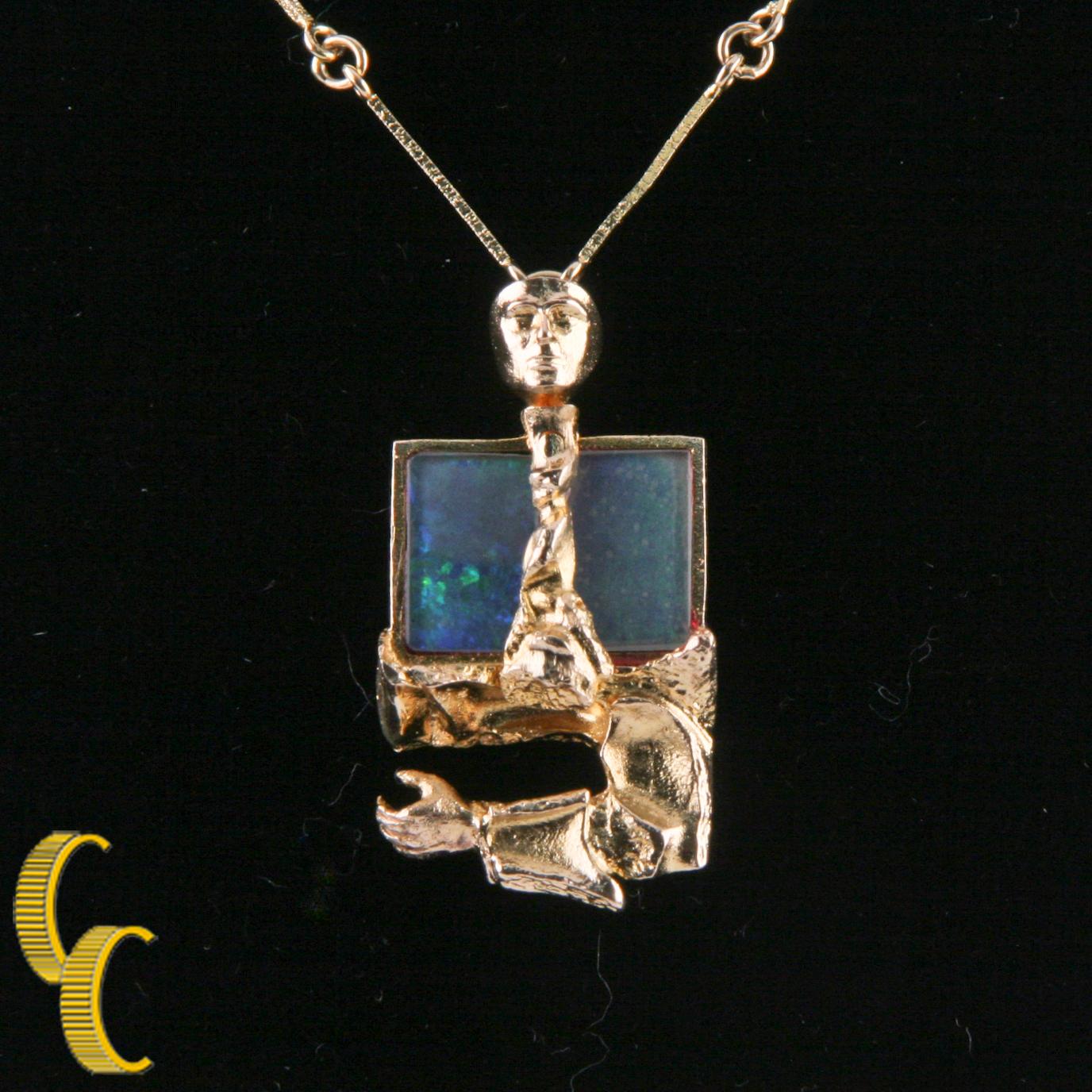 Gorgeous, Unique 14k Yellow Gold & Opal Necklace
Features 14k Yellow Gold Thin Bar Chain w/ Human Figurine 
Pendant Features Bezel-Set Black Opal Behind Figurine 
Pendant Wight = 15 mm
Pendant Height = 17.5 mm
Opal is 13 mm in Wide by 9 mm