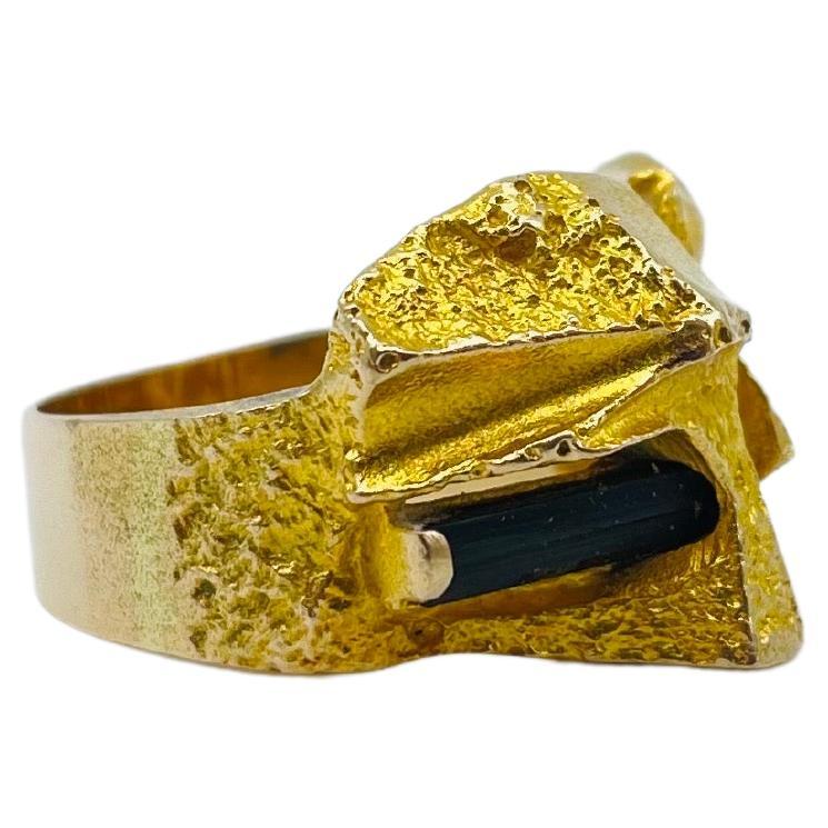 Presenting a truly magnificent piece of Finnish Modernist art - the Björn Weckström 14k yellow gold ring with a textured cubist surface and a bezel set, a true masterpiece that embodies the very essence of luxury and sophistication. Crafted by the