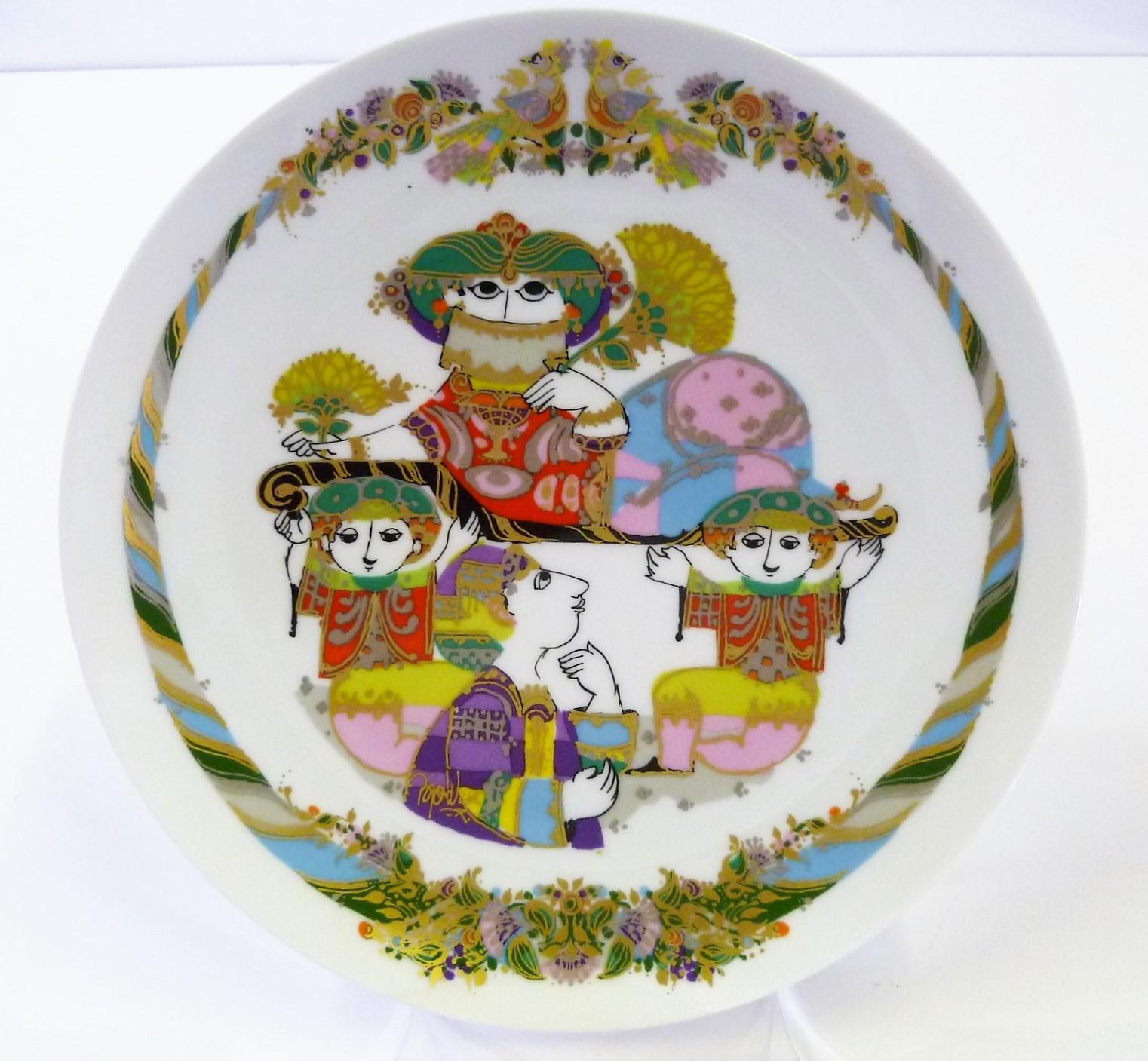 Colorful 1990s pair of Rosenthal white porcelain wall plates by Bjorn Wiinblad. 