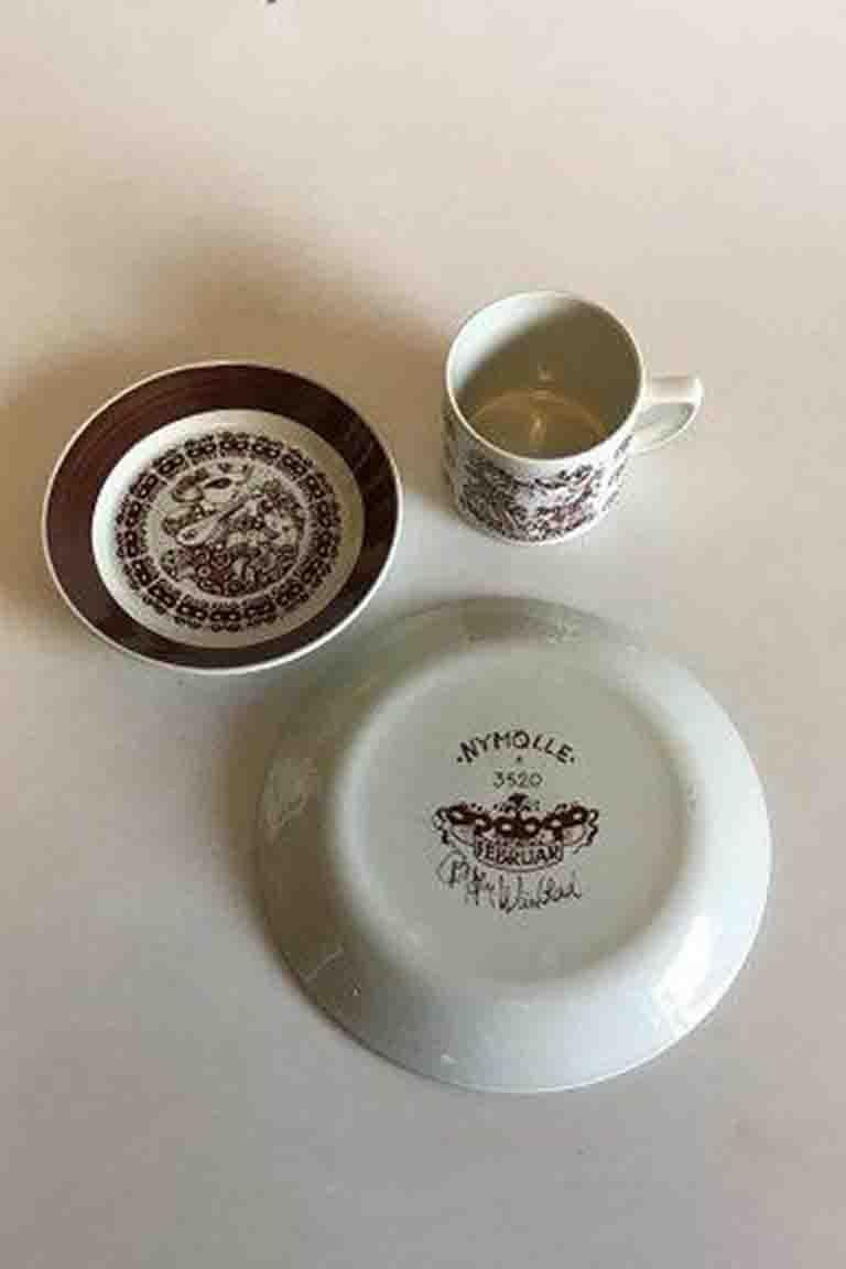 Bjorn Wiinblad, Nymolle February Month cup No 3513, saucer and cake plate No 3520. Measures Cup: 7 cm / 2 3/4 in. x 8 cm / 3 5/32 in. diameter. Saucer: 15 cm / 5 29/32 in. Cake plate: 20 cm / 7 7/8 in.
      