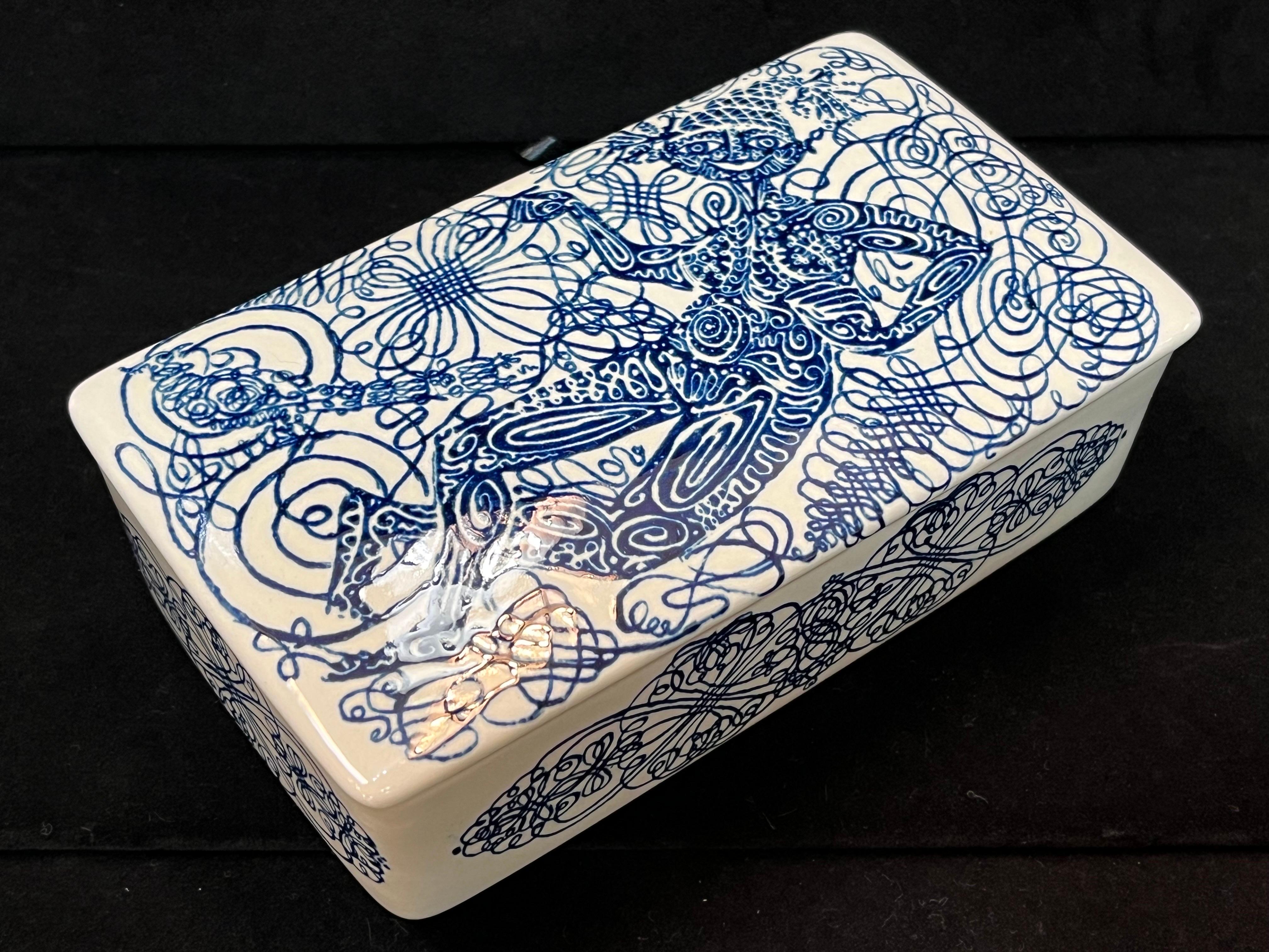 A vintage, mid to late 20th century lidded ceramic box with a transfer printed pen and ink drawing design by Bjorn Wiinblad (1918 - 2006). A few words about Mr. Wiinblad and Nymolle from the C20 Ceramics website, 