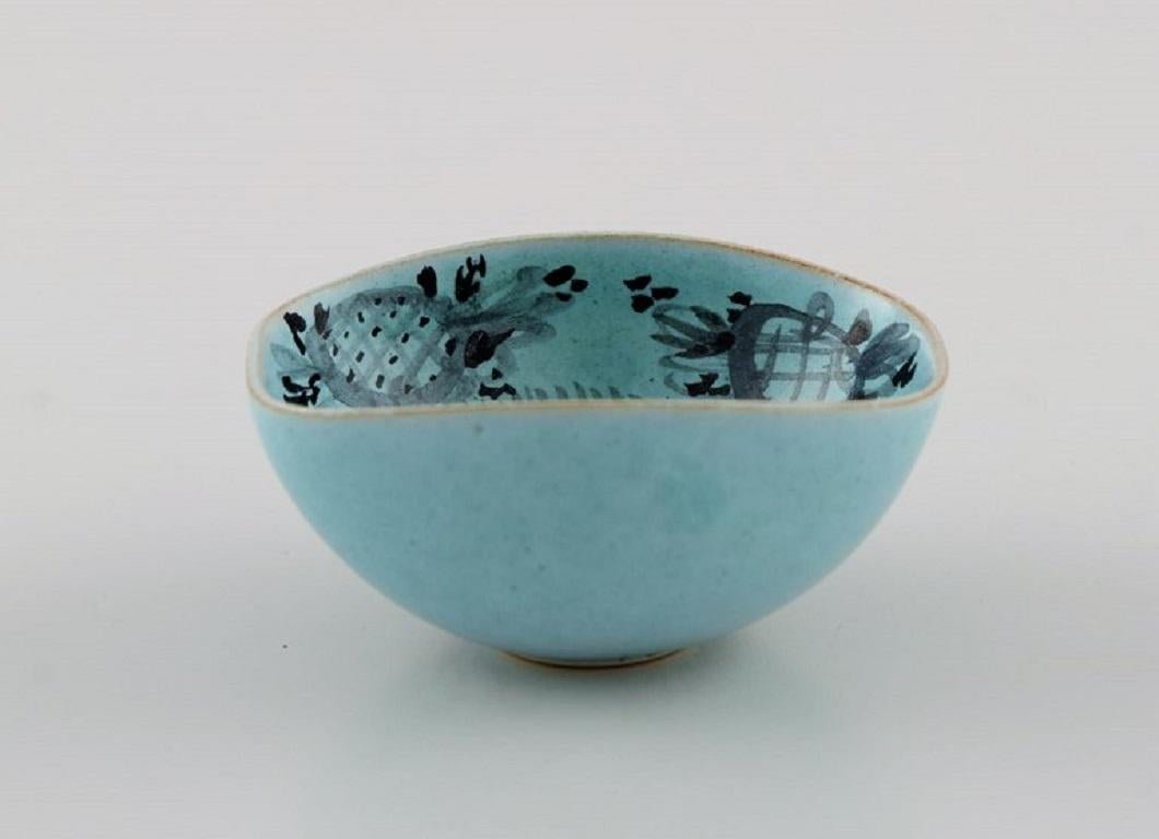 Bjørn Wiinblad (1918-2006), Denmark. 
Unique miniature bowl in glazed ceramics with a hand-painted female face. 
Dated 1951.
Measures: 5.5 x 4.5 x 2.7 cm.
In excellent condition.
Signed and dated.