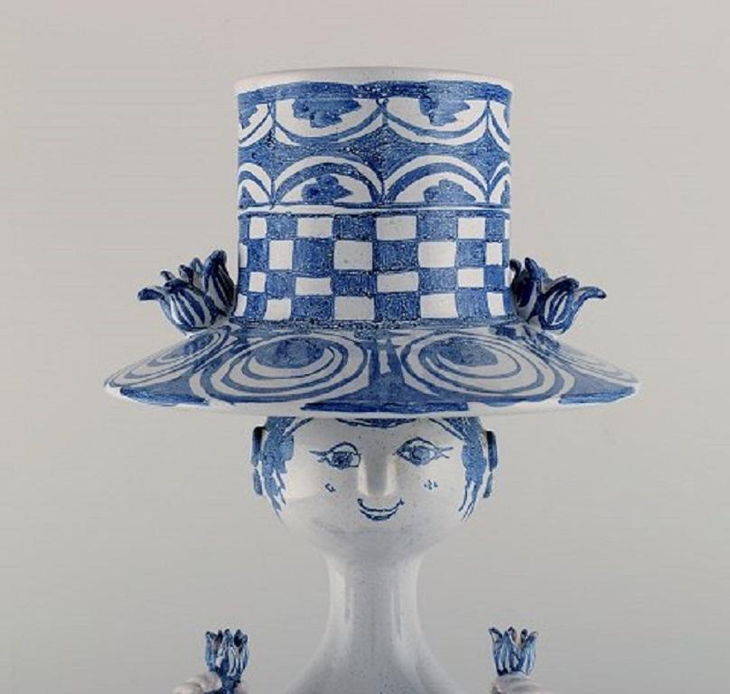 Bjørn Wiinblad (1918-2006), Denmark.
Very large female figure in hand painted glazed ceramics with a flowerpot in the form of a hat.
Dated 1976.
Measures: 51 x 20 cm.
In excellent condition.
Signed and dated.