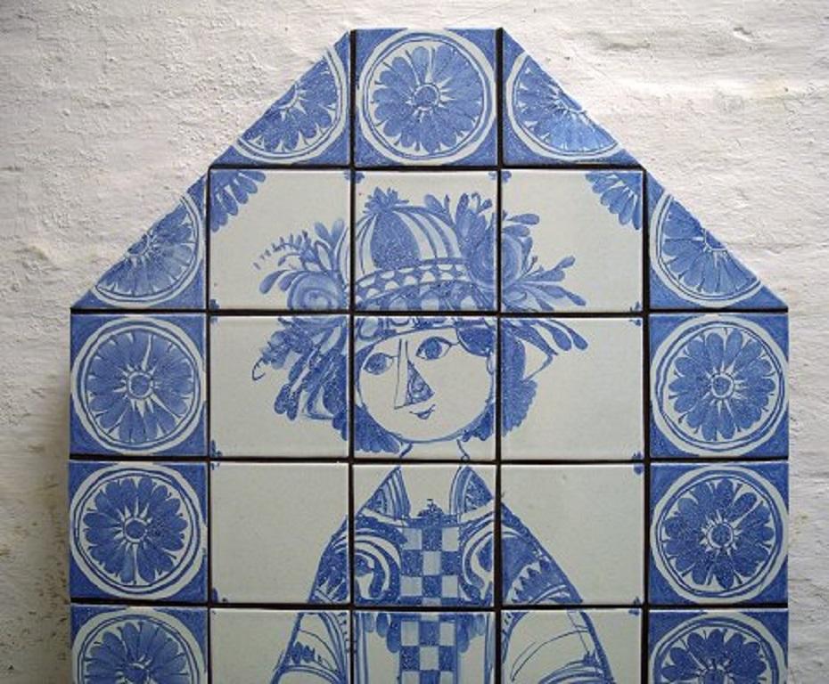 Bjørn Wiinblad (1918-2006). Huge octagonal unique candle holder wall plaque with three light arms made of blue glazed ceramic tiles.
Hand-painted with a woman and flowers surrounded by geometric ornamentation. Dated 1973.
Signed and