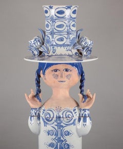 Bjørn Wiinblad. Colossal sculpture of girl with a hat designed to hold a plant.