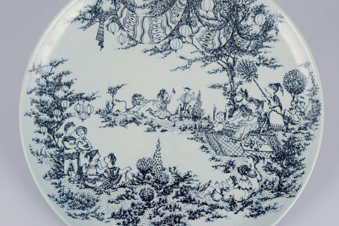 Bjørn Wiinblad for Nymølle, Denmark. 
Large round dish in faience.
Motif from 
