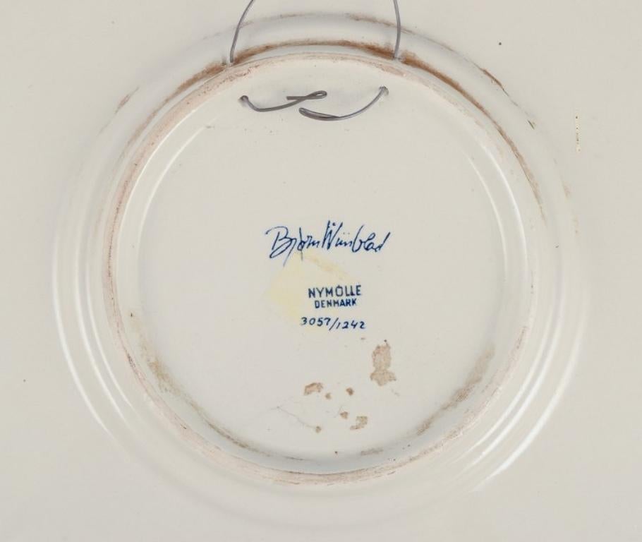 Danish Bjørn Wiinblad for Nymølle, Denmark. Two large faience dishes, 1970s For Sale