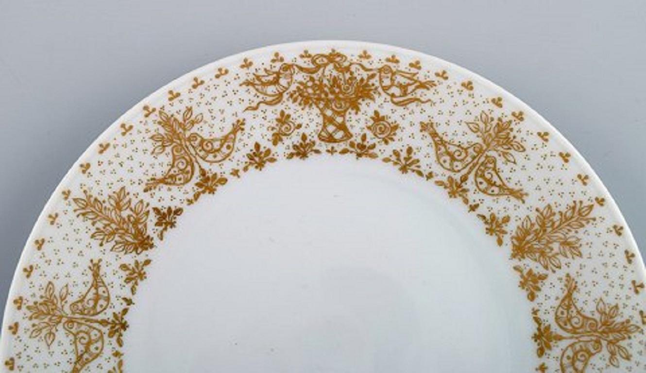 Allemand Huit assiettes en porcelaine décorées d'or Bjrn Wiinblad pour Rosenthal