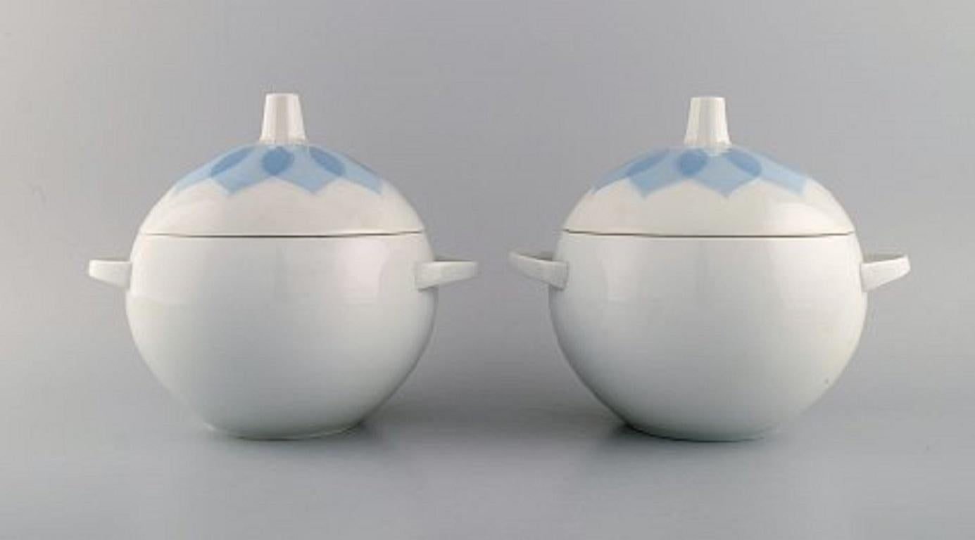 Bjørn Wiinblad for Rosenthal. Two Lotus porcelain lidded tureens decorated with light blue lotus leaves. 1980s.
Measures: 22 x 19 cm.
In excellent condition.
Stamped.