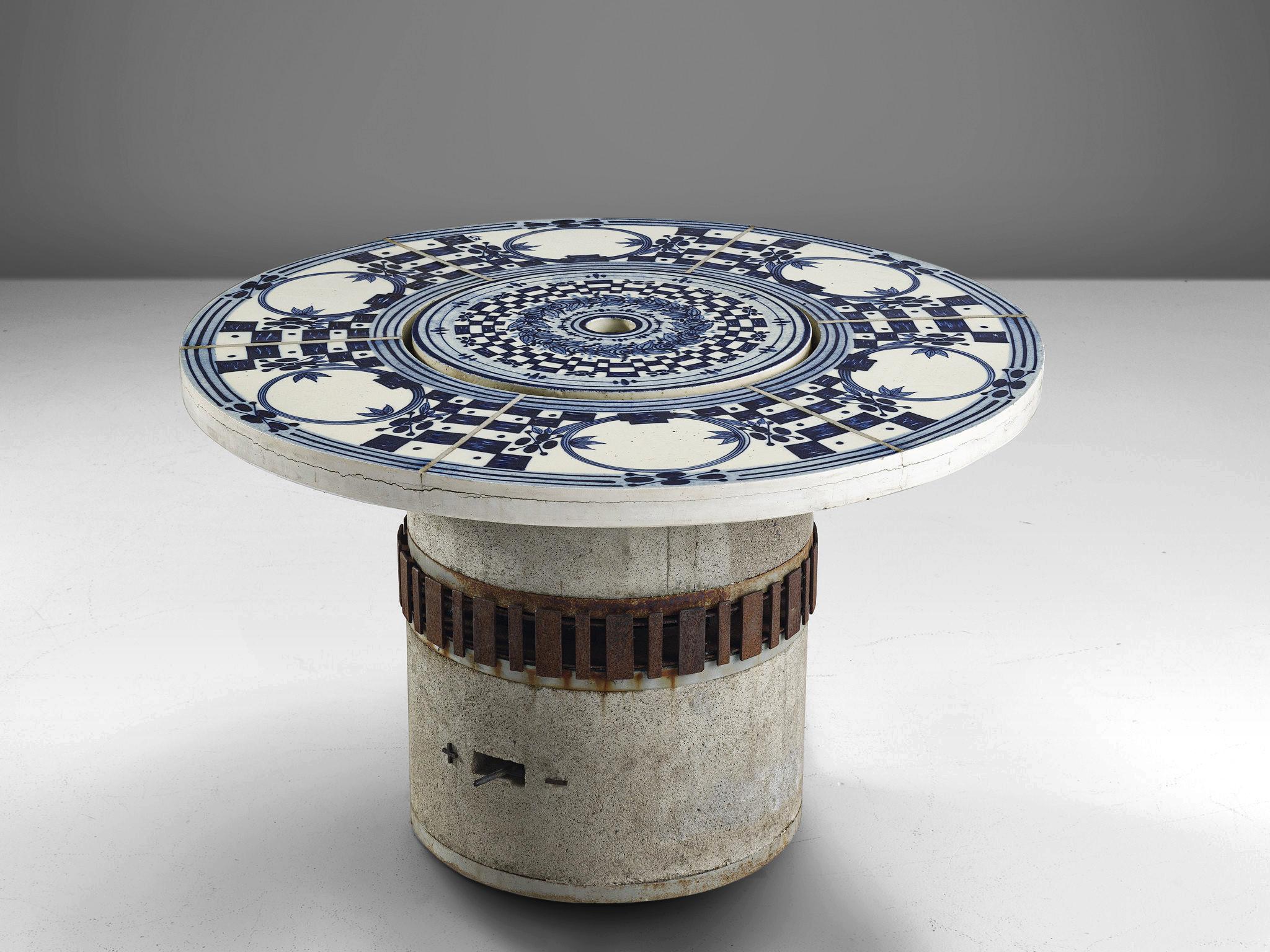 Bjørn Wiinblad, 'Hibachi' grill table, faience tiles and glazed concrete, metal, Denmark / Germany, 1970s

This garden table is decorated with hand painted ceramic tiles in blue and white color. The top features a removable centre beneath which is