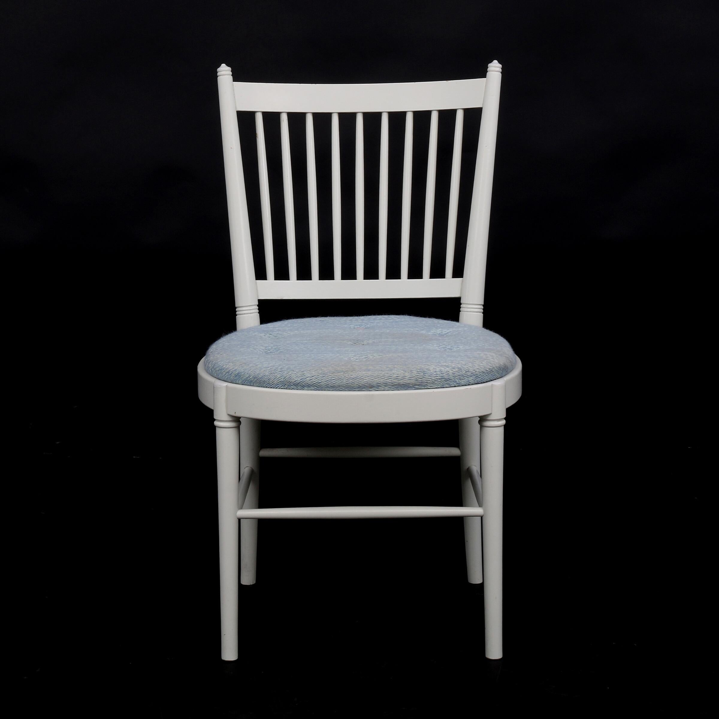 In 1967 Bjørn Wiinblad and Brita Drewsen together designed a series of wooden Gustavian Style furniture: Set of eight chairs of white lacquered wood. Seat upholstered with blue striped deep-woven wool. (8) Made by Nessjö Stolefabrik and sold through