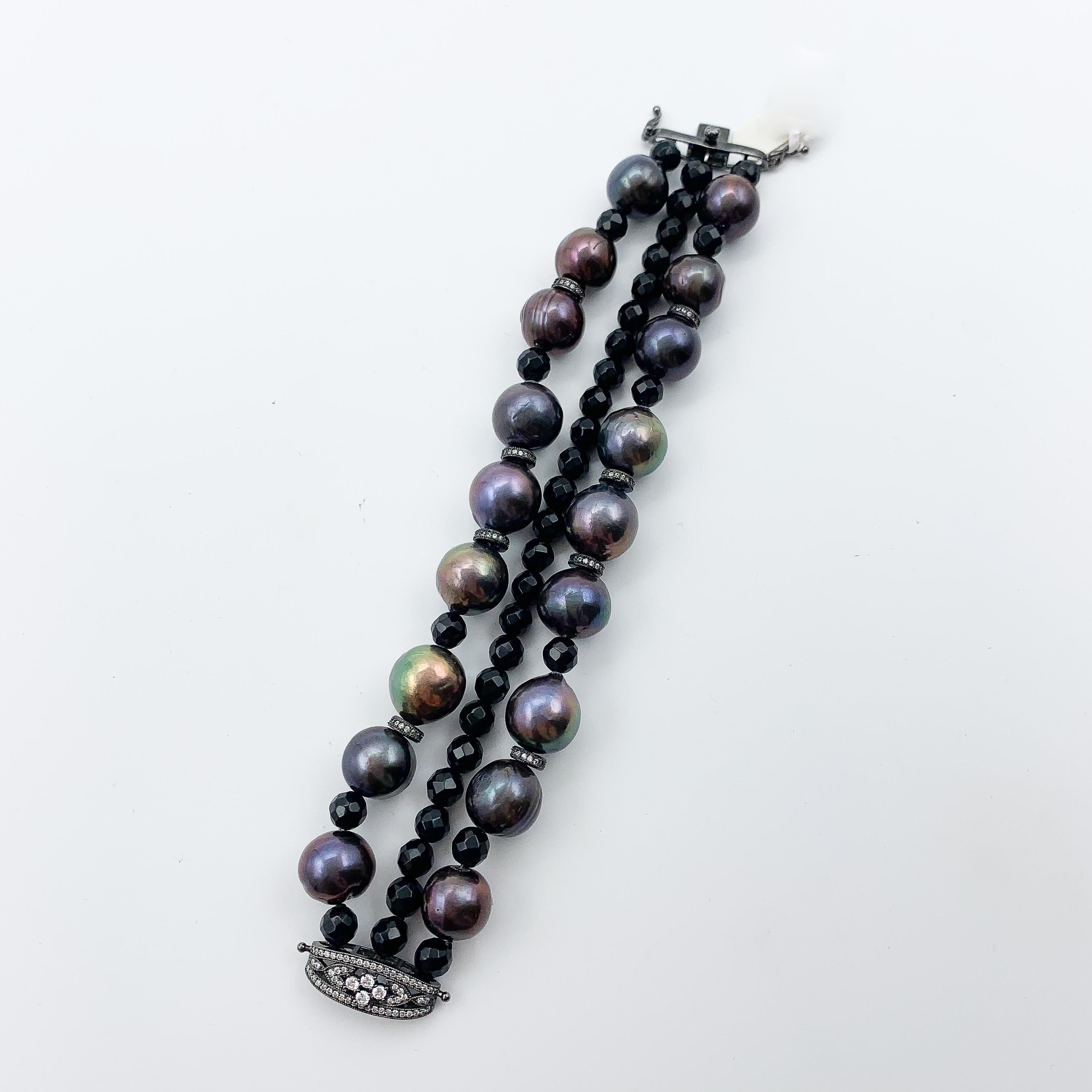 -Sterling cz 
-Bk-rhodium black onyx beads 
-12-13mm bk pearls
- Open box clasp 
-7in length