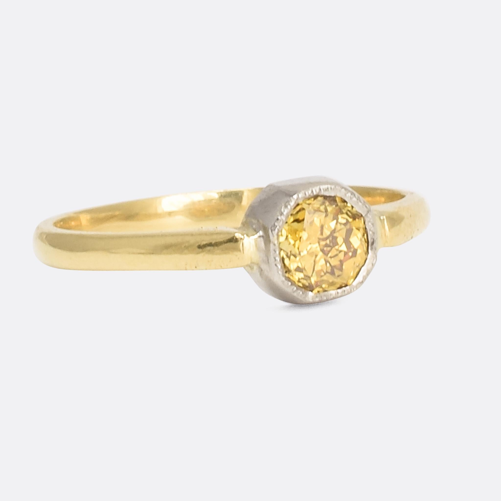 A unique diamond solitaire ring designed by Butter Lane and set with a exceptional vintage coloured diamond. The stone is certified as .56ct Fancy Intense Orangish-Yellow, VS1 clarity and modified octagonal cut - with natural colour and no evidence