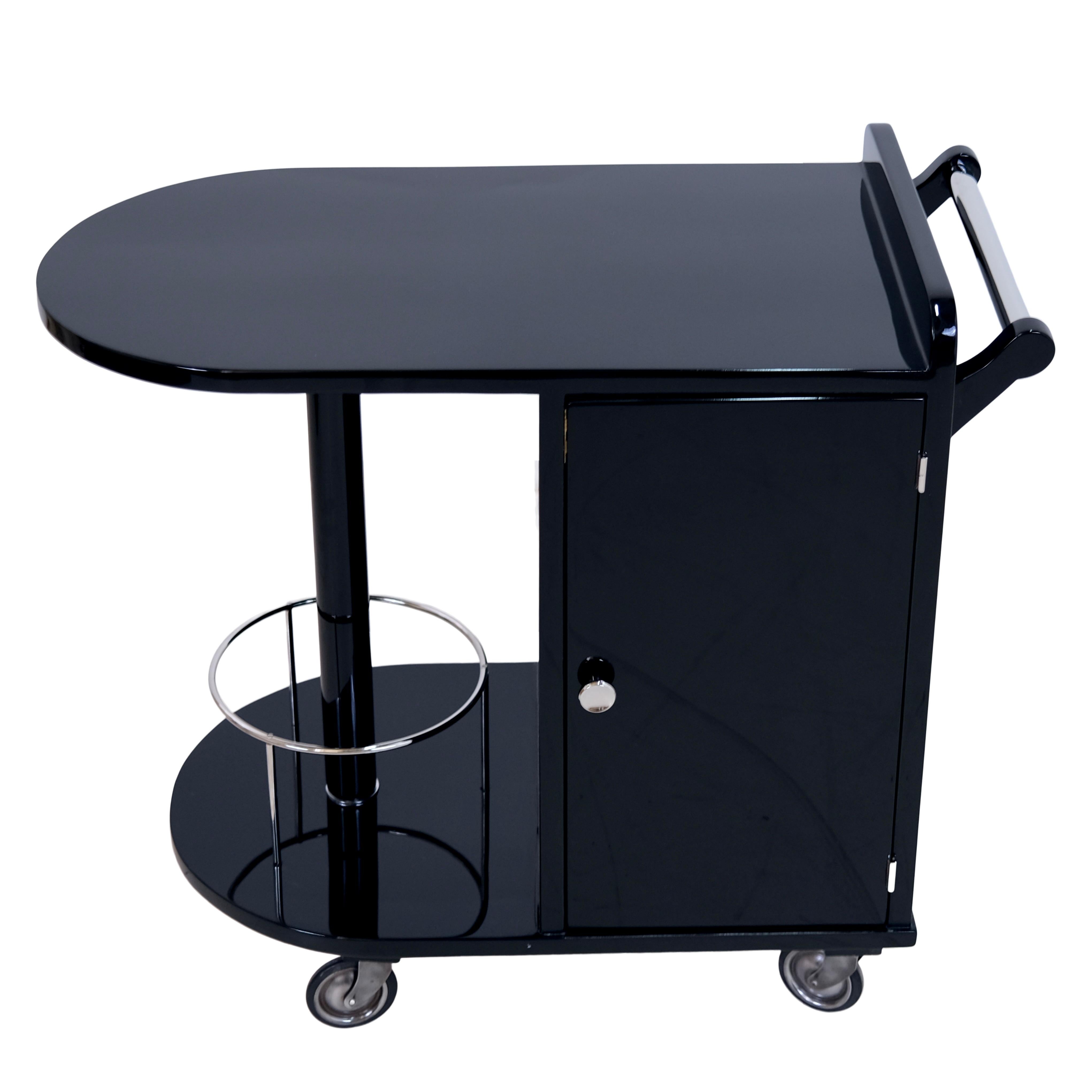 Bar trolley with two doors
Round bottle cage on column
High gloss black piano lacquer

Original Art Deco, France 1930s

Dimensions:
Width: 80 cm
Height: 72.5 cm
Depth: 40 cm.