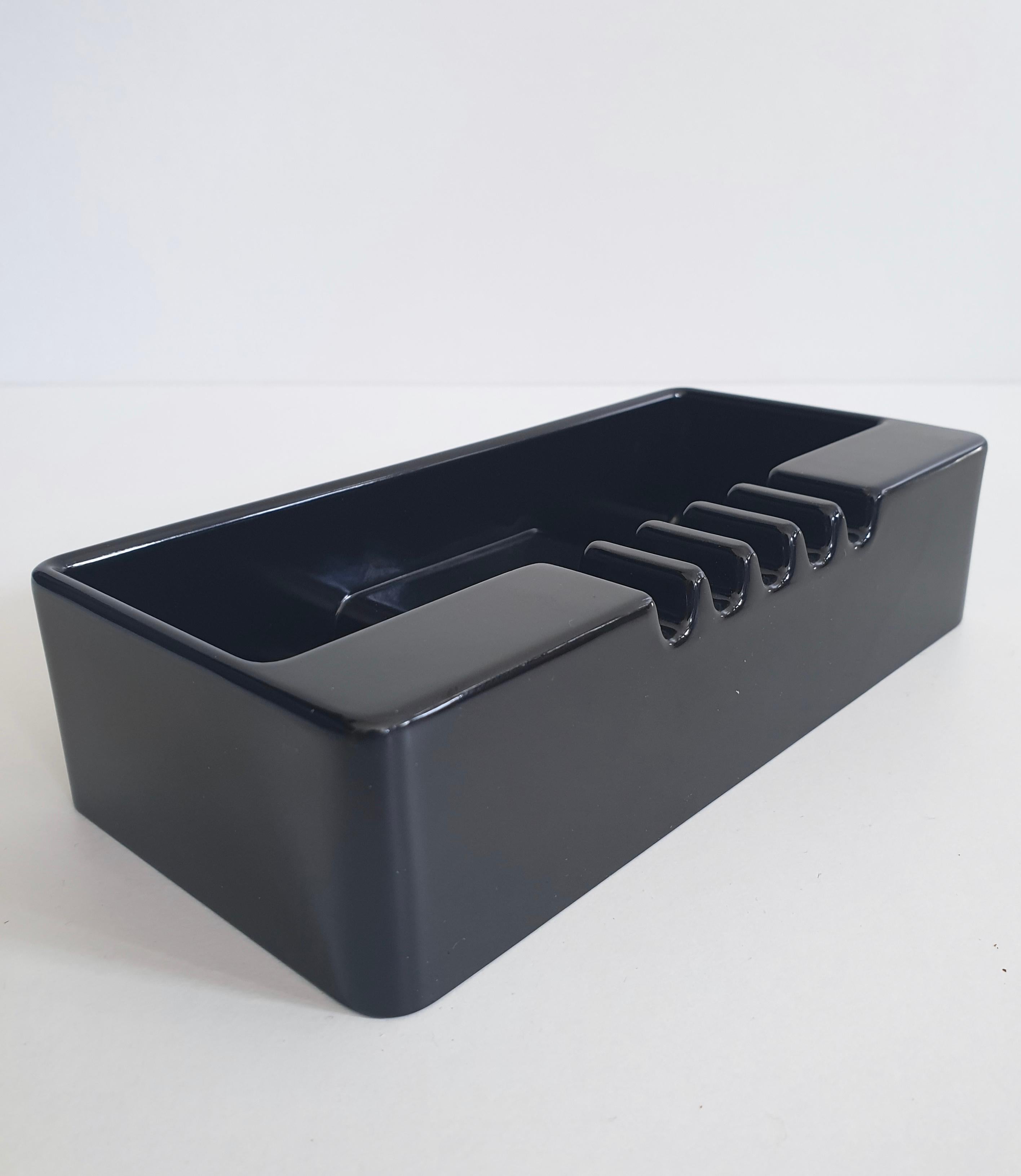 Black ABS ashtray, come desk tidy, by Italian design icon, Ettore Sottsass for Olivetti as part the synthesis range in the 1970s.

In remarkable condition with the original box. Also available in khaki green. The larger sculptural ashtray from the