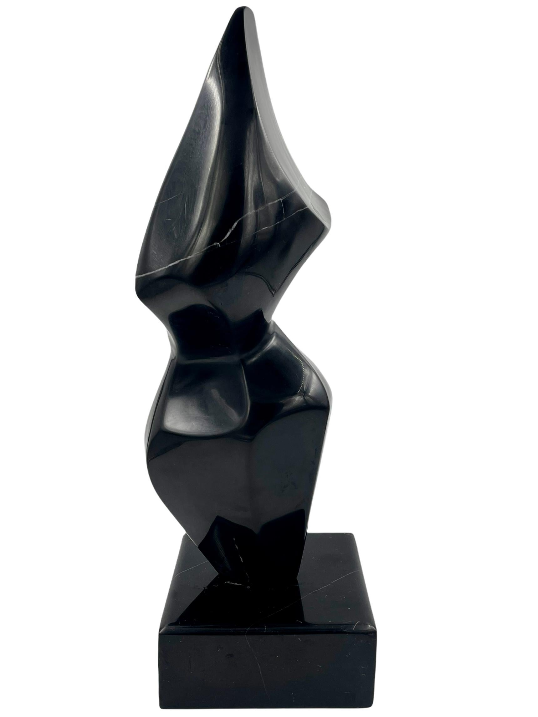Abstract marble sculpture. Unique polished pink black abstract sculpture with a matching base. This beautiful one of a kind sculpture would make a great art piece to add some sophistication to your home or office.

Measures: 18