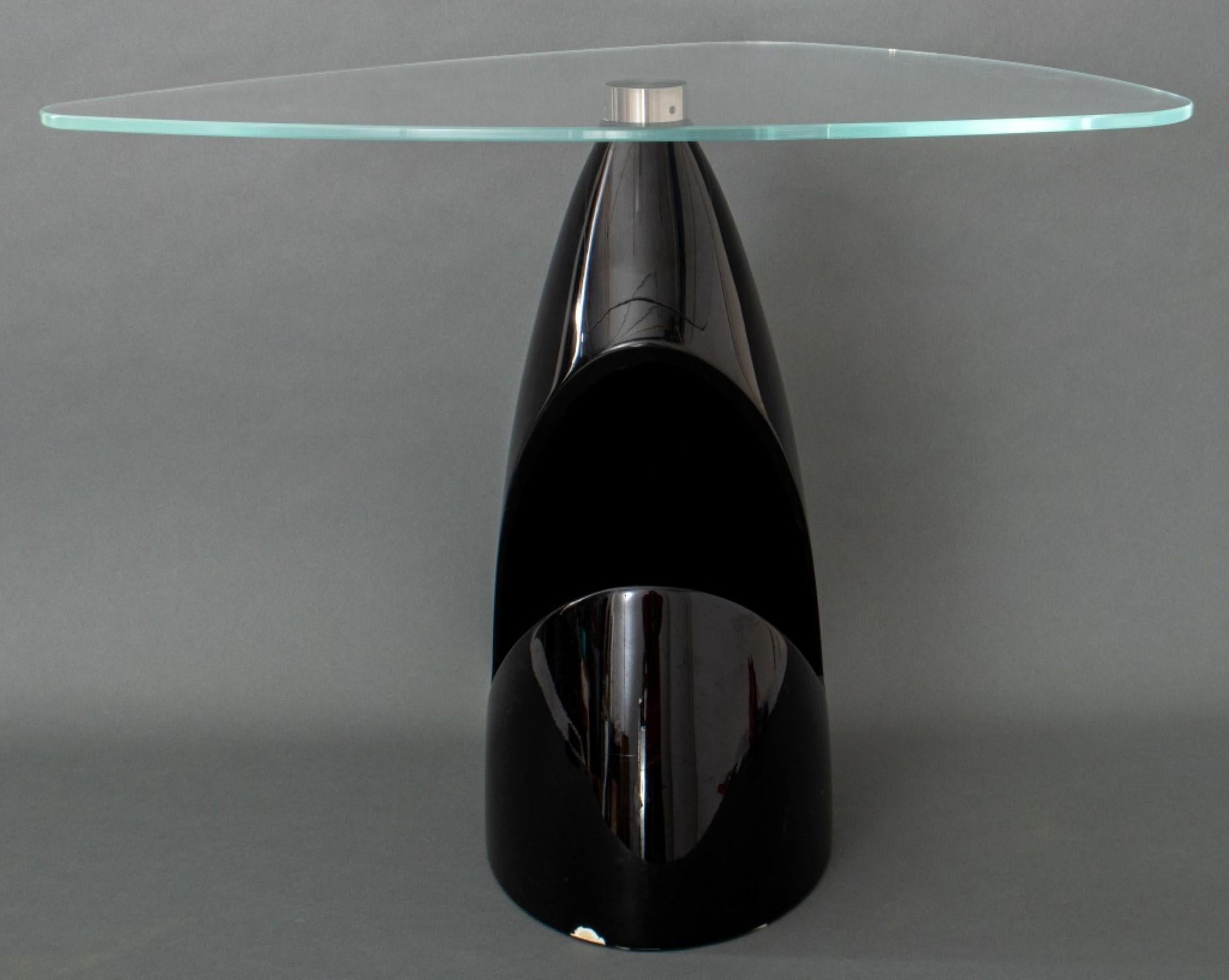Black Abstract Sculptural Side Table

Materials: Fiberglass and metal base with glass top
Style: Abstract sculptural
Unsigned: No artist's mark identified
Dimensions: 18.5