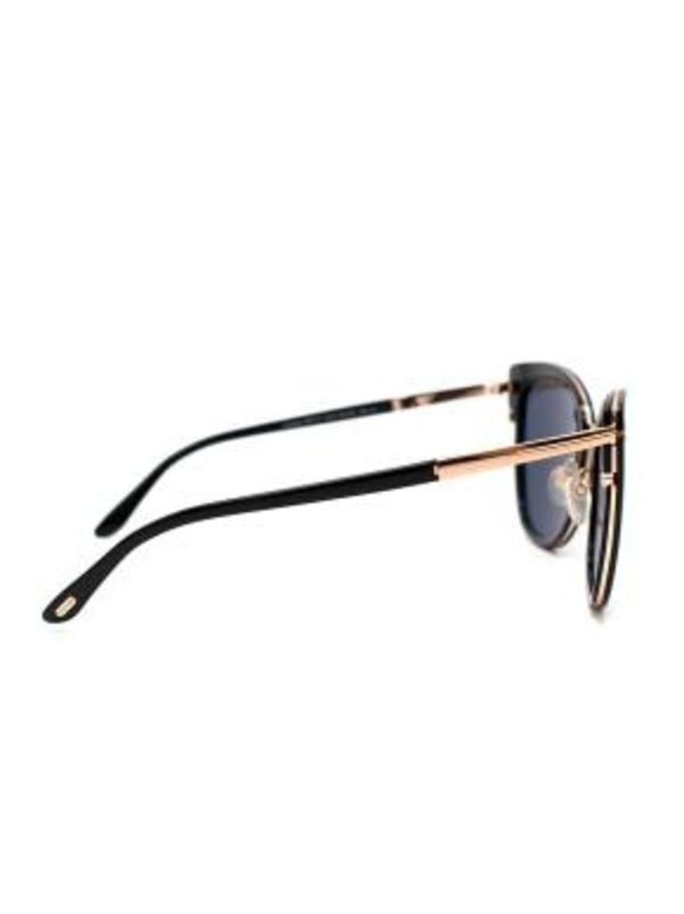 Tom Ford black acetate & gold-tone metal Simona sunglasses
 
 - Elegant black cat eye frame sunglasses with the signature Tom Ford T logos wrapped around the outer corners and along the temples
 - Black lenses
 - Rose gold-tone hardware 
 - Branded