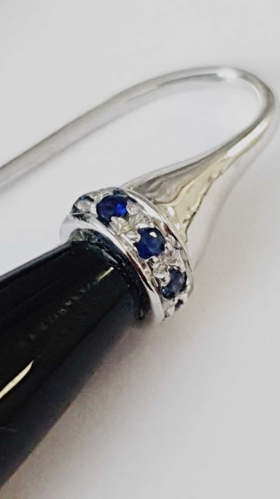Elegant earrings in 18kt white gold, black agate and blue sapphires
White Gold g. 4
Blue saphires ct. 0,16
Black agate pendulum 
Hook system


