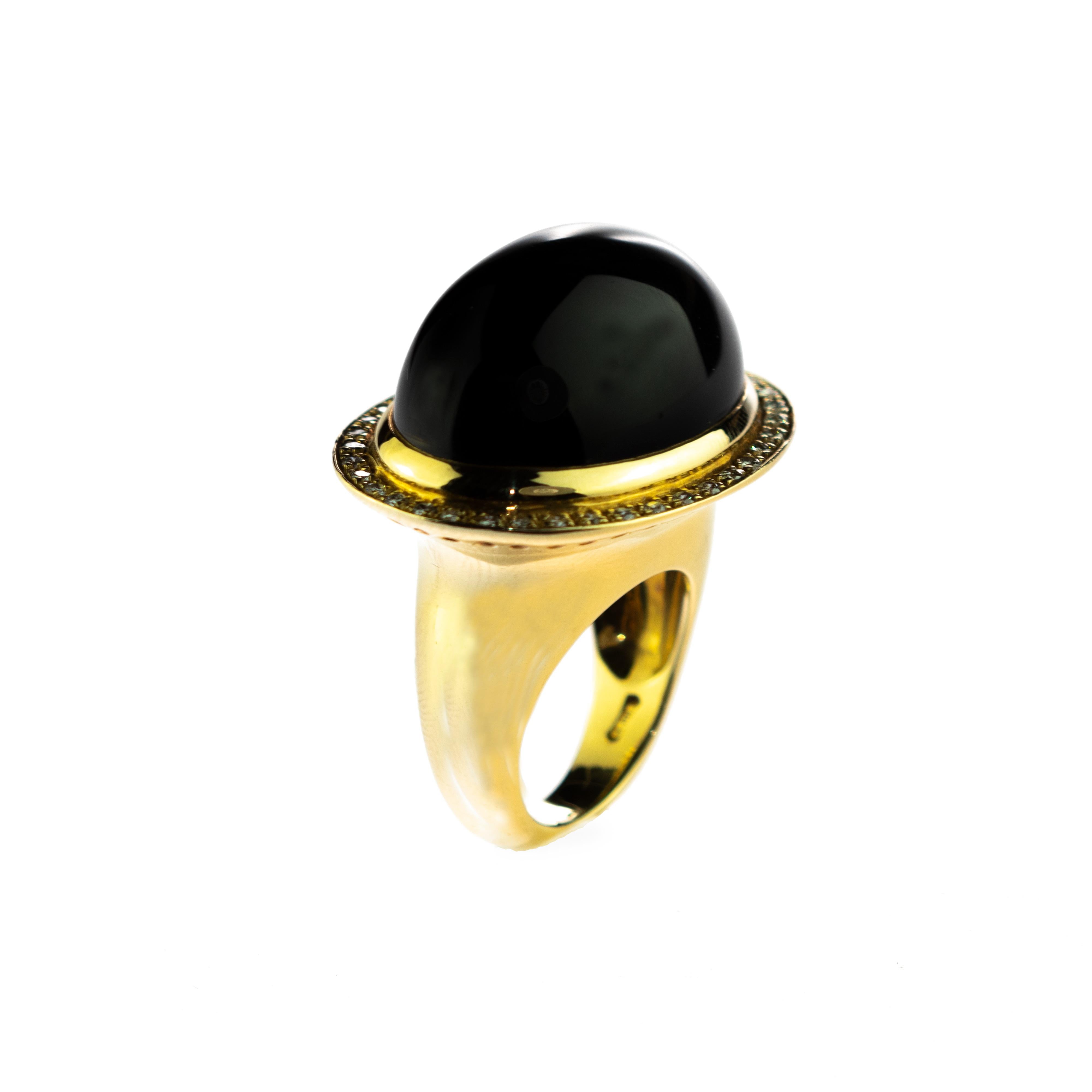 Stunning masterpiece with a black oval cut agate stone encircled by shining diamonds.

This ring is inspired by the human mind. It shows the greatness of an unknown and infinite knowledge that we must explore every day. Diamonds represent the soul