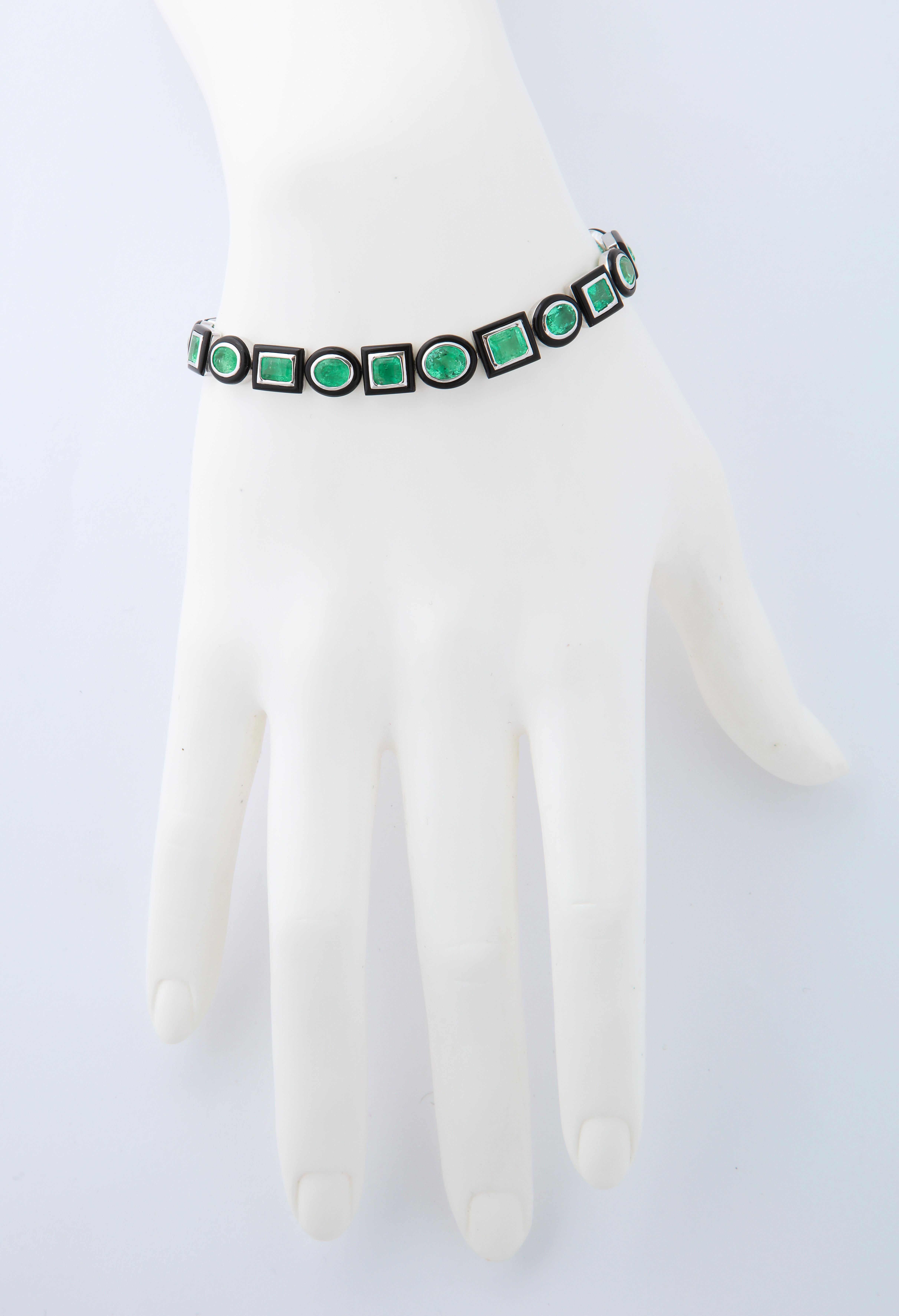 Alternating emerald cut and oval emeralds set in 18kt white gold and framed by hand cut black agate.  The strong colors and sharp contrast create a dramatic new take on a tennis bracelet.  Versatile to be worn in casual and more elegant settings.
21