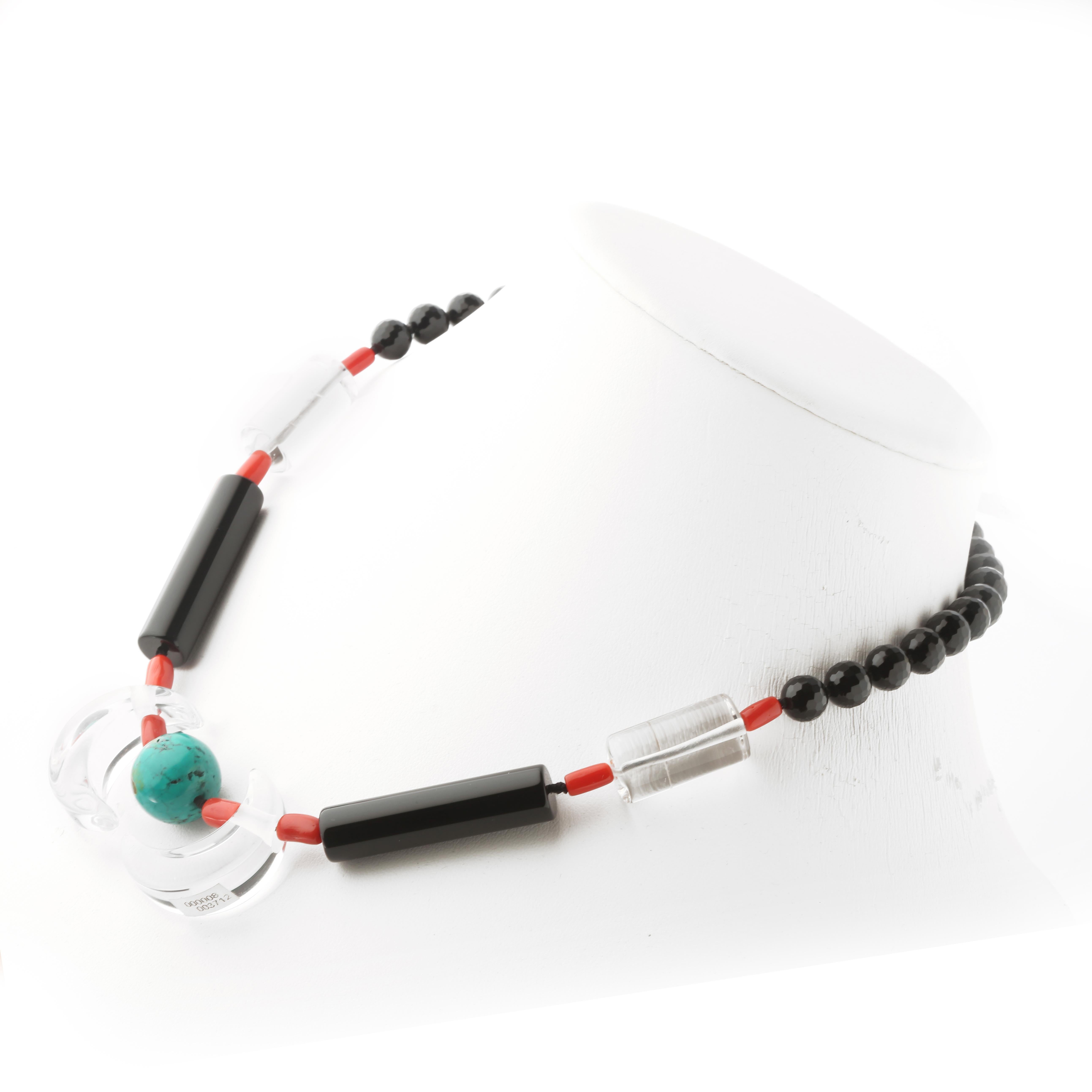 Immerse yourself in the beauty of this uniquely designed necklace with natural stones full of life and color. 
This necklace is inspired by the bright light of the moon during clear sky nights.

Choker necklace with faceted black Agate, Natural