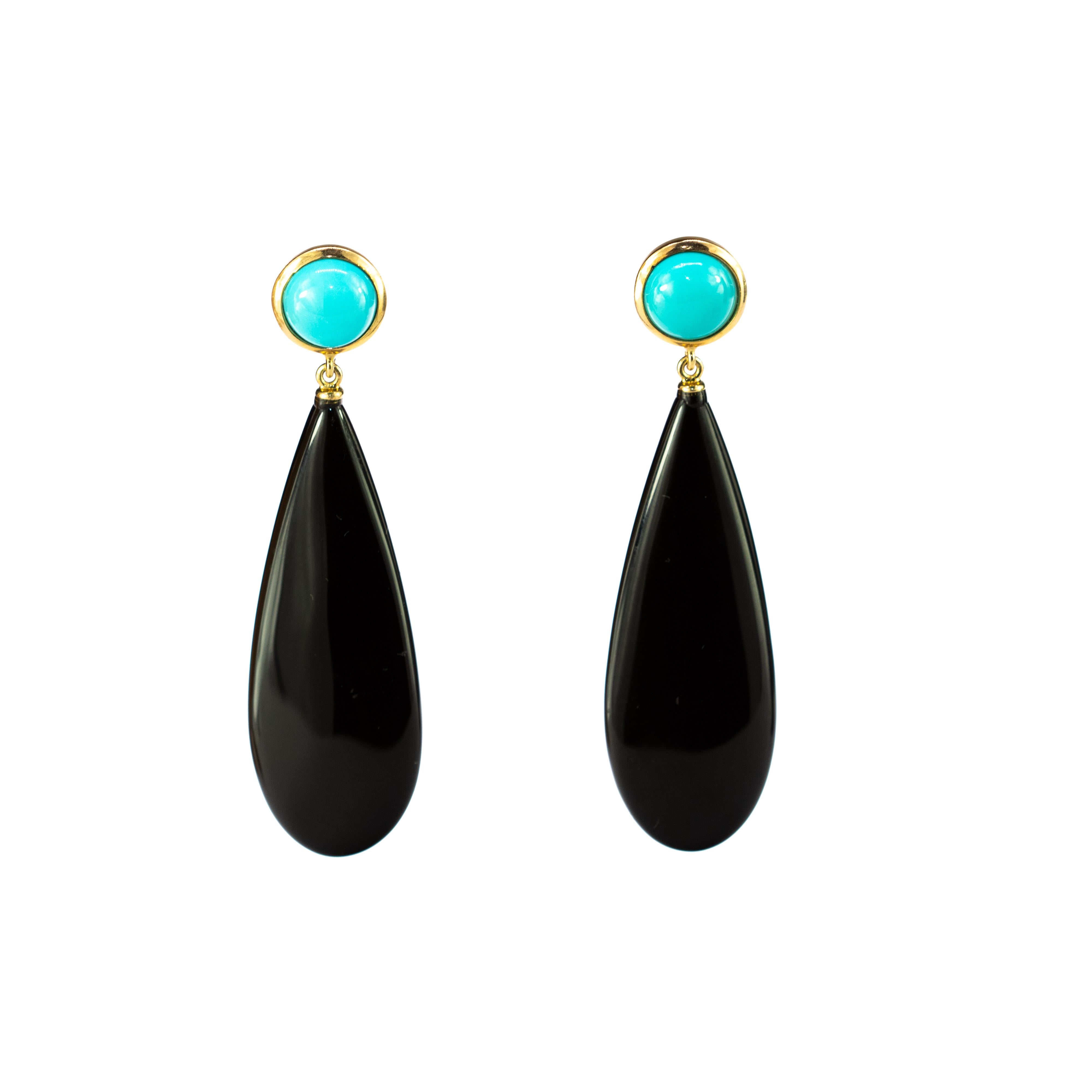 Black agate chandelier drops medium size. With two turquoise gems combining voluminous shapes with vivid colours, resulting in bold, free-spirited pieces with a charming elegance.

The turquoise is one of the most desired jewels since the beginning