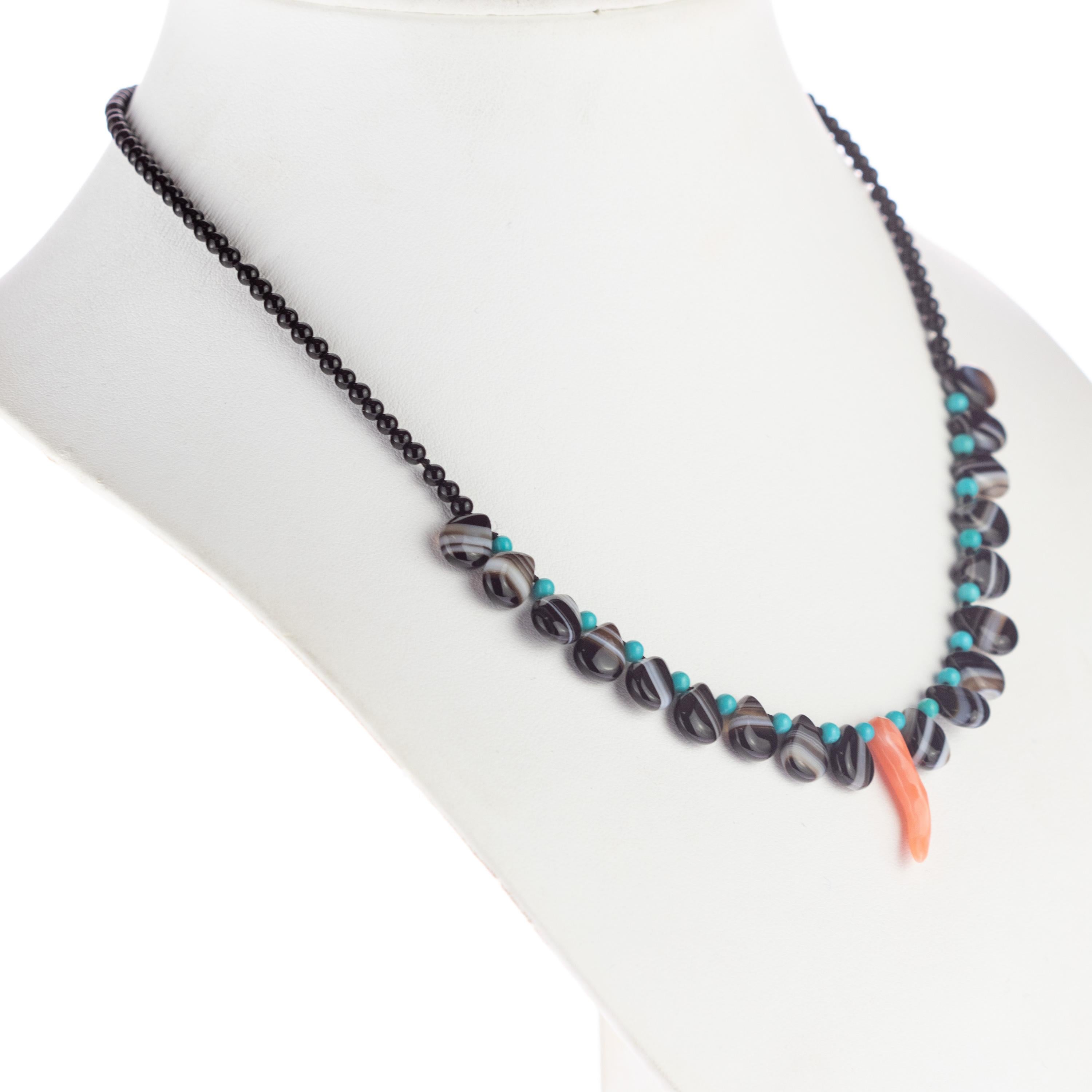 Fine handmade jewellery with Ethical and Natural Precious Stones of the best Quality.

This charming necklace is made with Turquoise, black striated Agate and a central pendant of Red Coral.

If you are a woman who doesn't renounce to a bright style