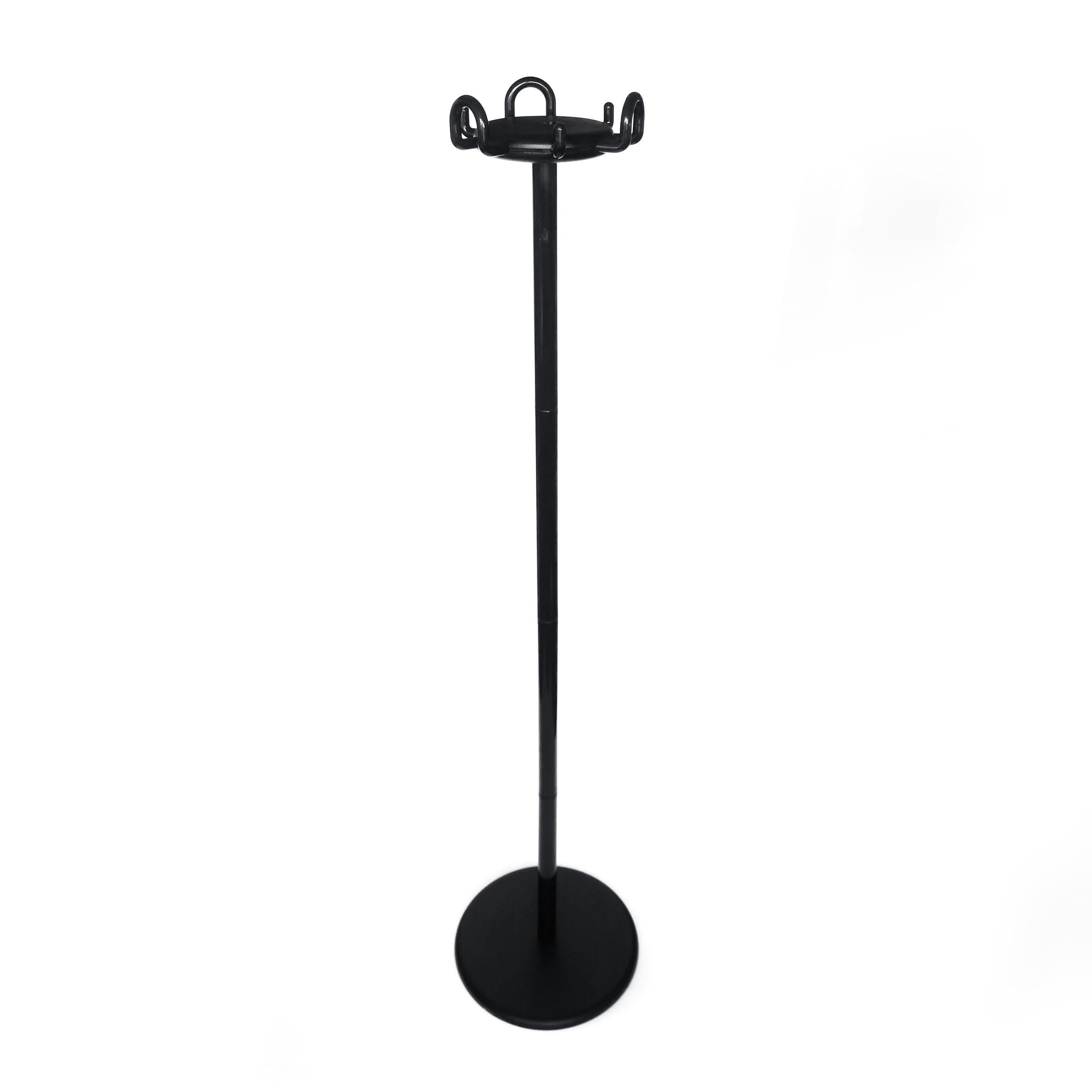 A classic and always fashionable black Aiuto coat stand designed by Raul Barberi and Giorgio Marianelli for Rexite in 1982 as the company's first coat rack. Black steel base, black polymer coated metal stem, with multiple polymer coated metal hooks