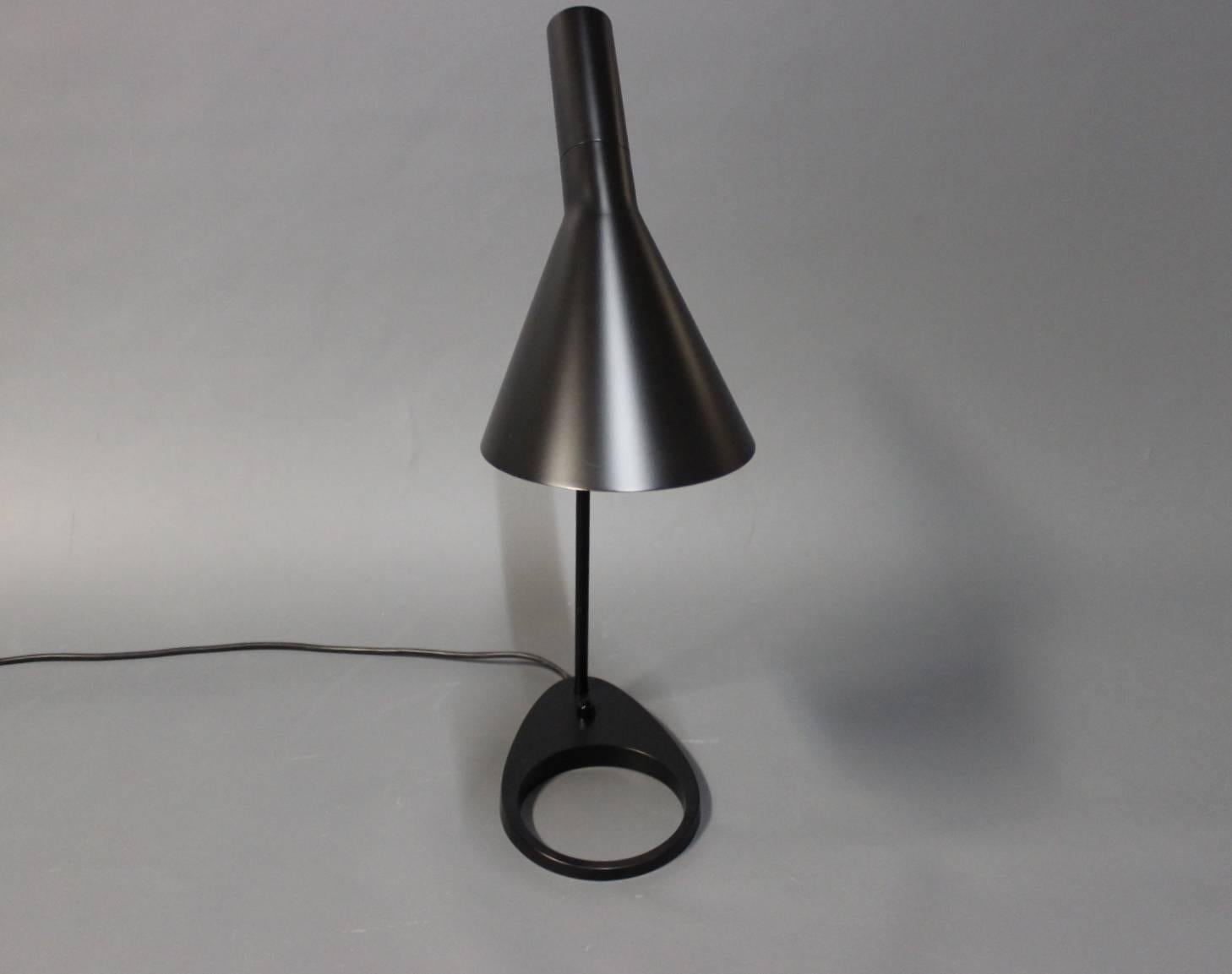 Black AJ table lamp, model 1808, designed by Arne Jacobsen in 1960 and manufactured by Louis Poulsen, circa 2000s.