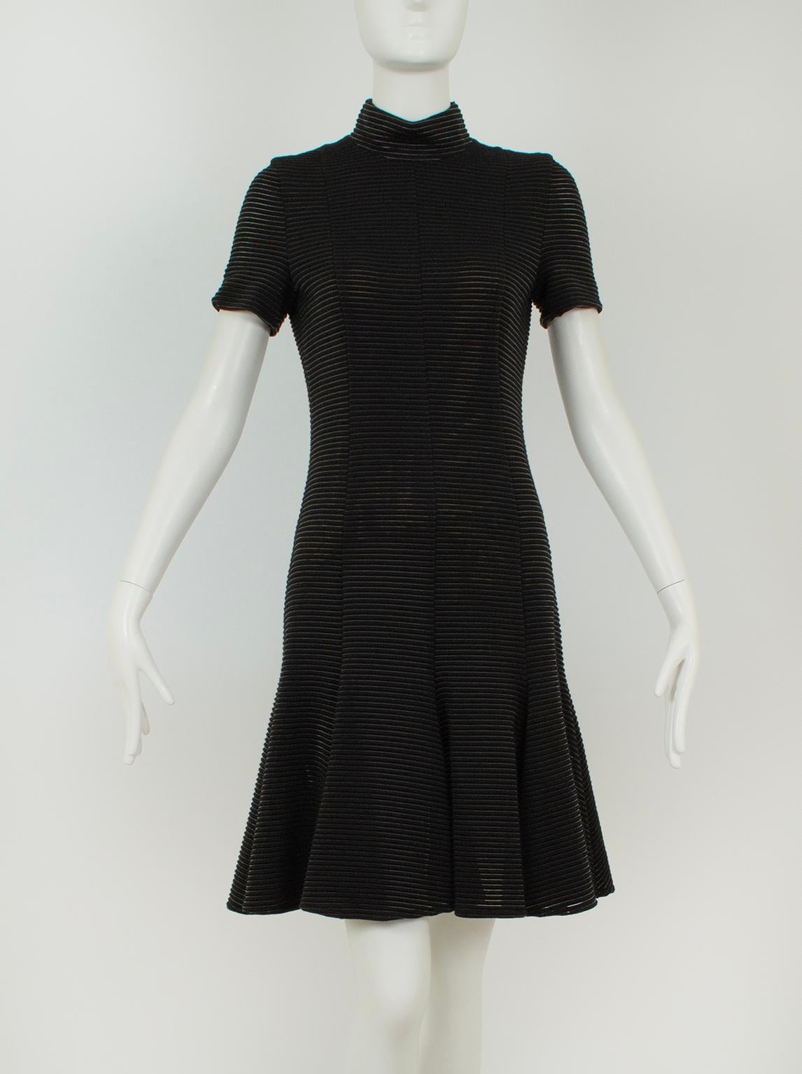 A dress that gives Alaïa a run for his money, this Akris model features the same famous fit and flare silhouette while hitting the knee instead of above it. Short sleeves and a mock t-neckline offer daywear styling that can easily transition to